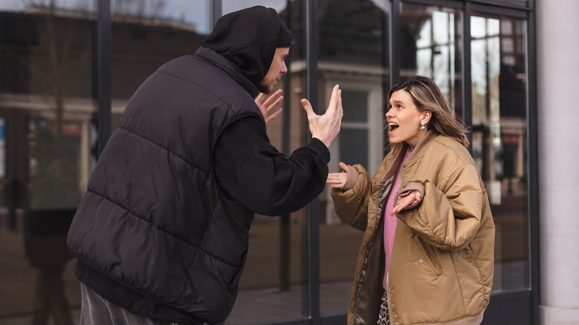 couple arguing criticizing each other in public