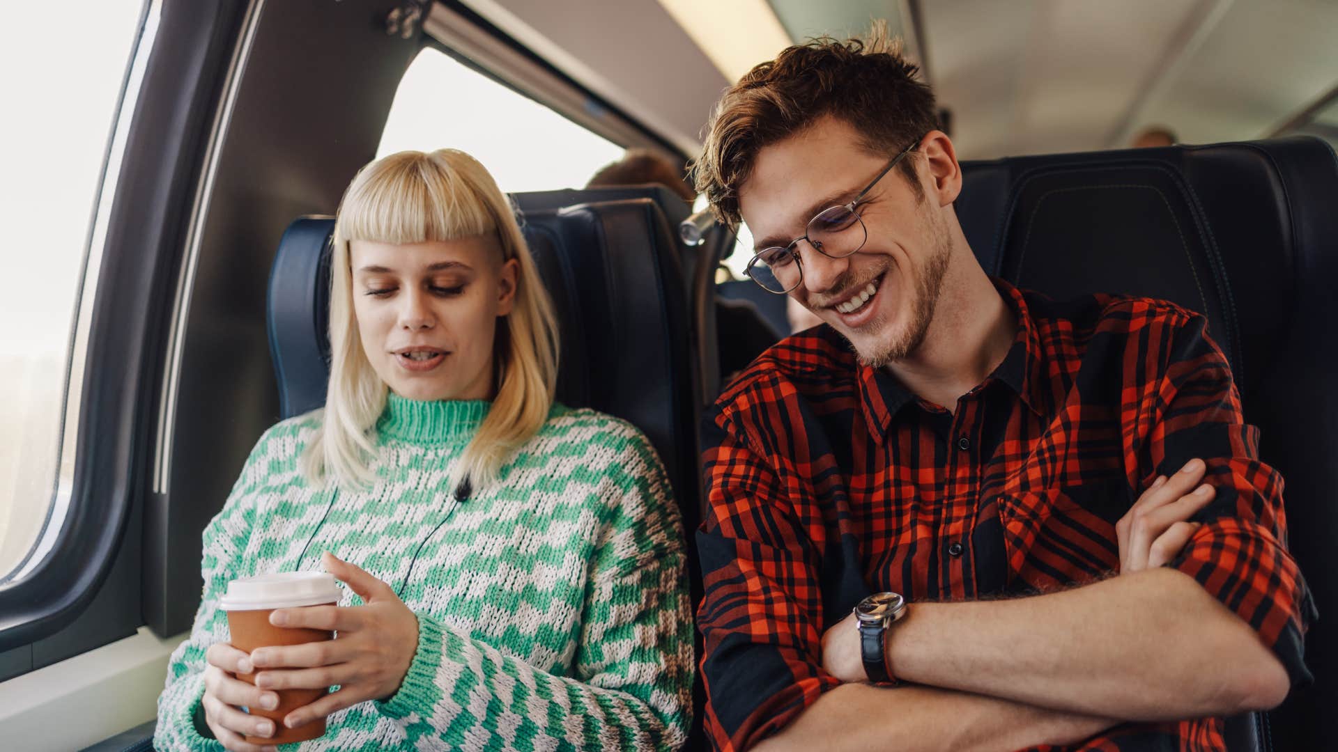 couple on a train listening to each other with intention