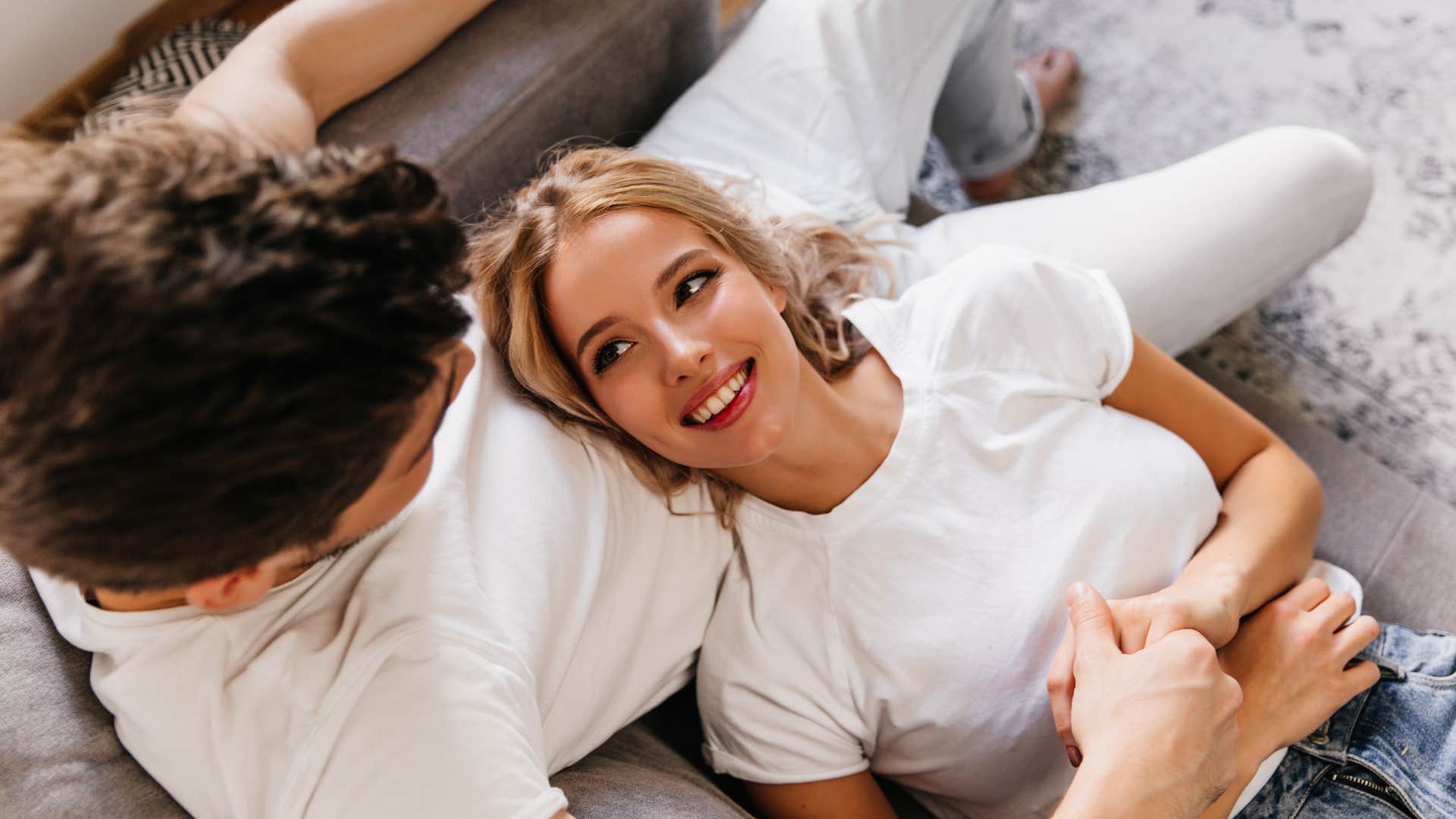 couple who values trust snuggling on the couch together
