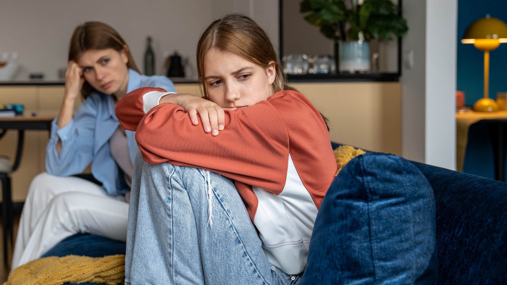 daughter ignoring her moms advice looking sad
