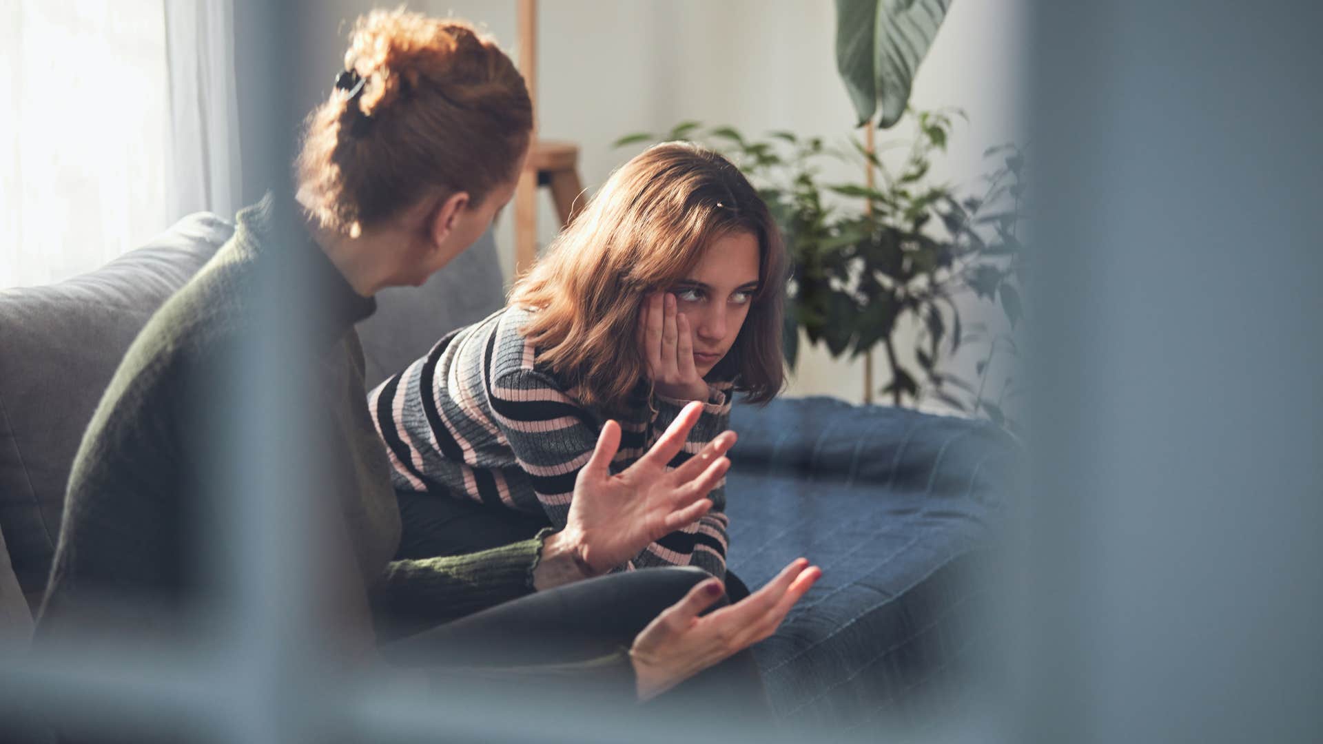 daughter acting annoyed with mother