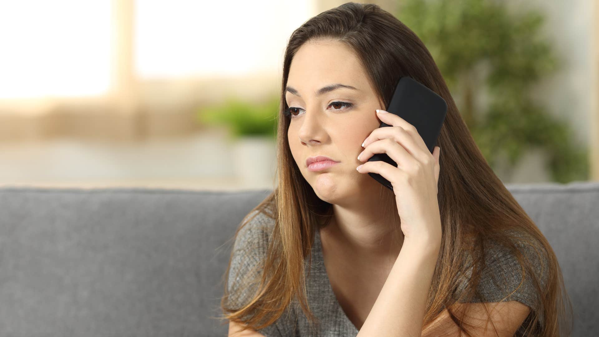 woman showing no interest in her mother's life on phone