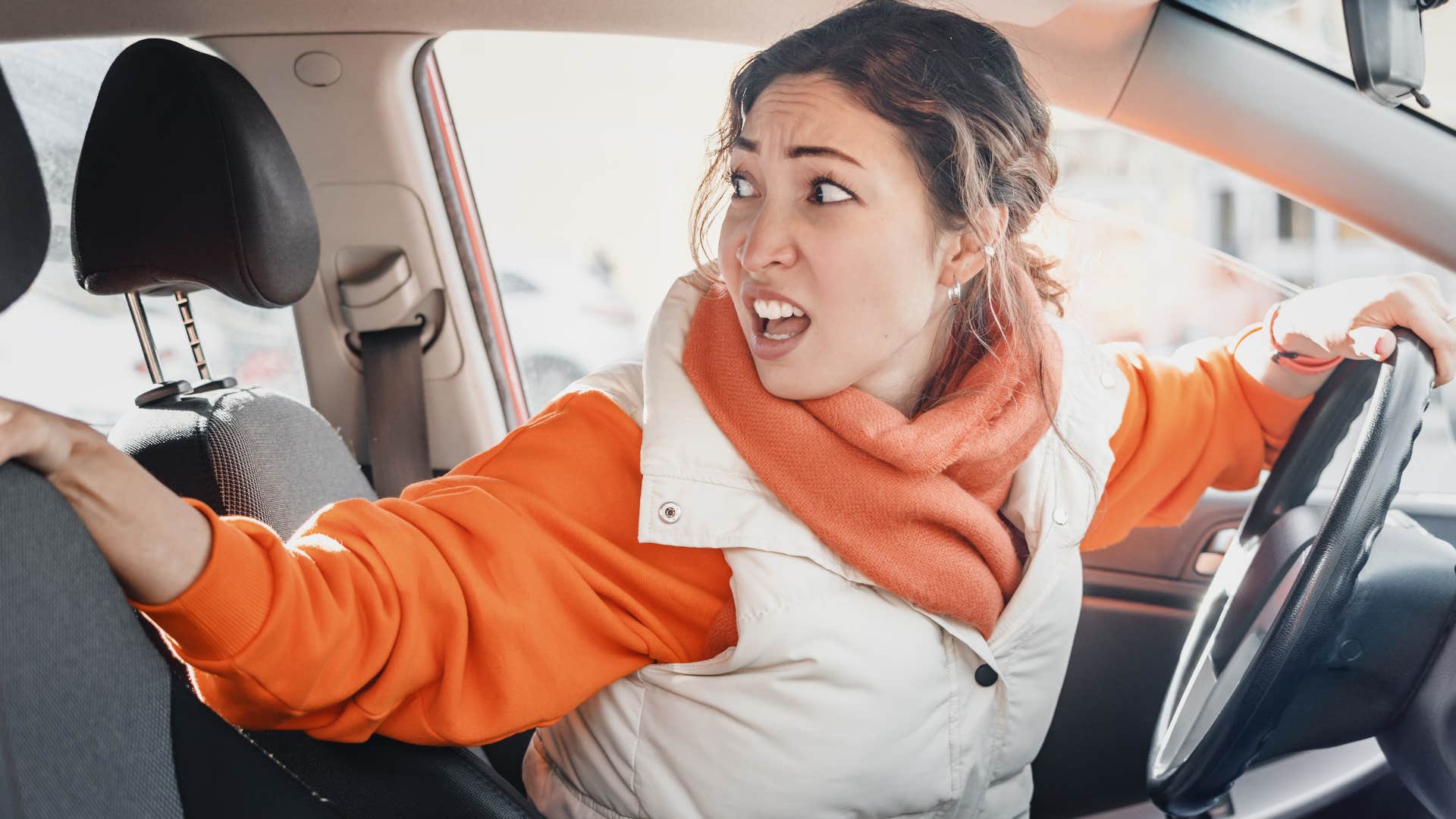 bad driver who never learned she doesn't have the right-of-way when backing up