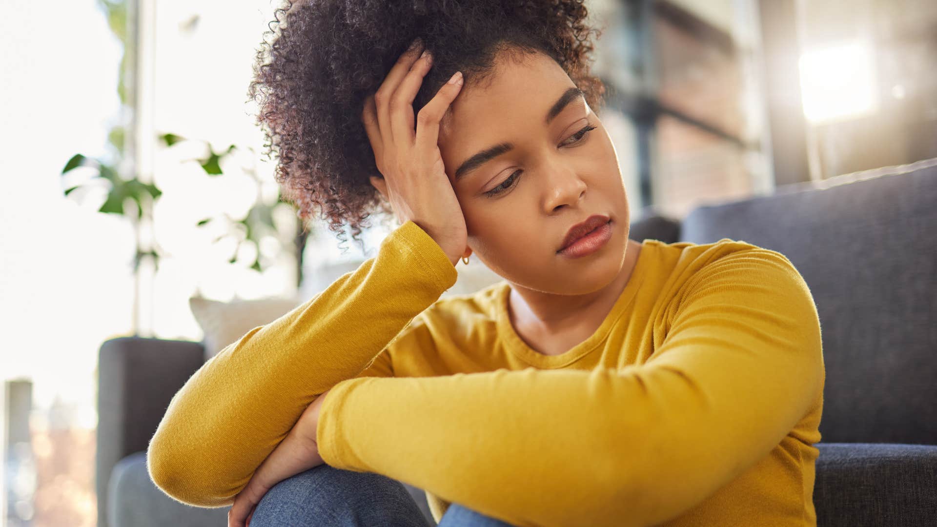 young woman thinking about her regrets