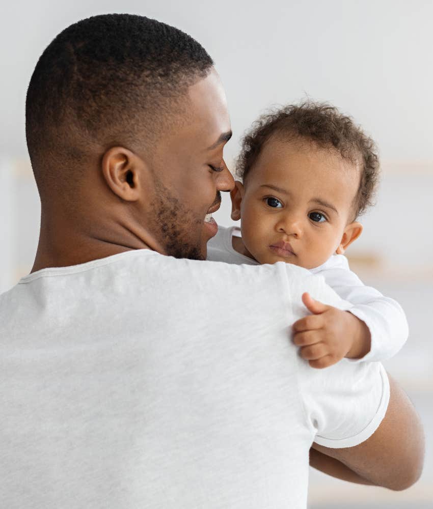 man holding baby