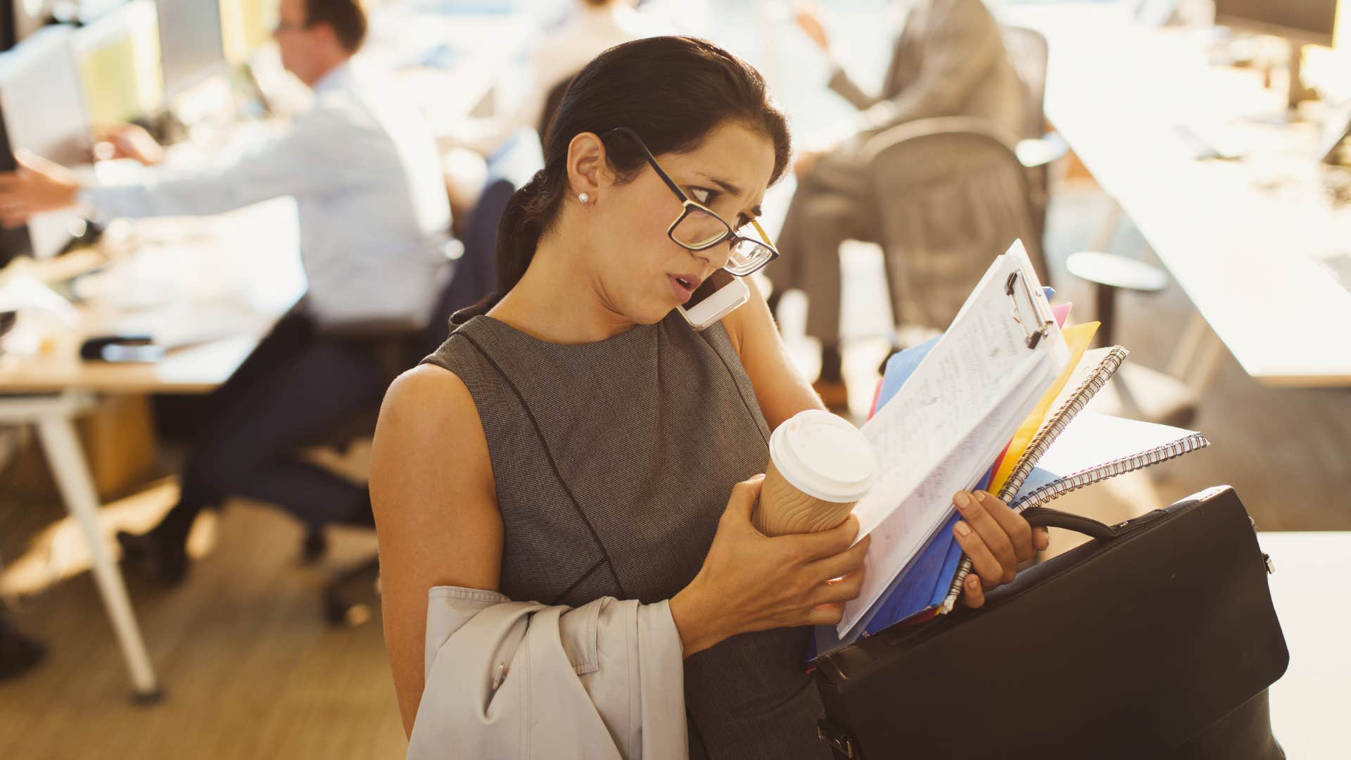 woman struggling with work-life balance in the office