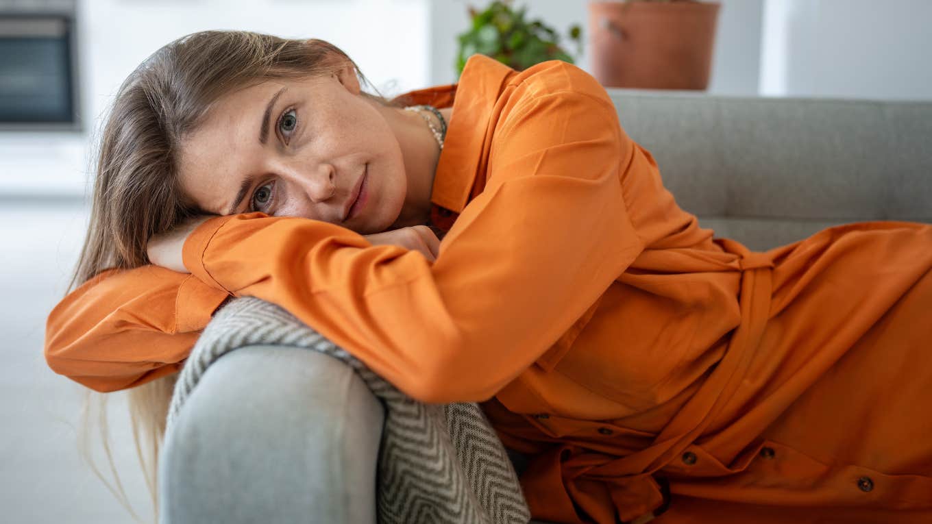 exhausted woman on her couch unable to set boundaries