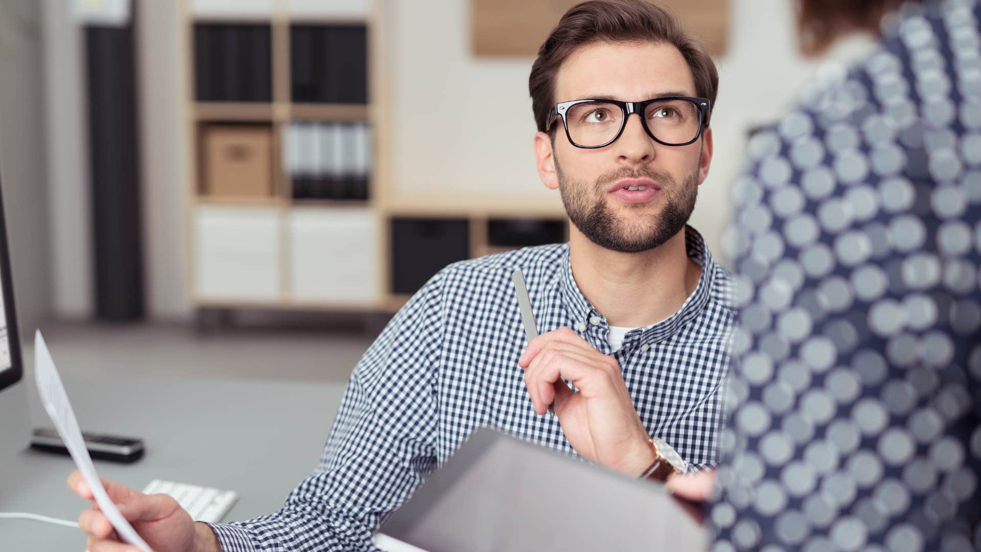 man confronting co-worker saying you certainly have the gift of simplicity