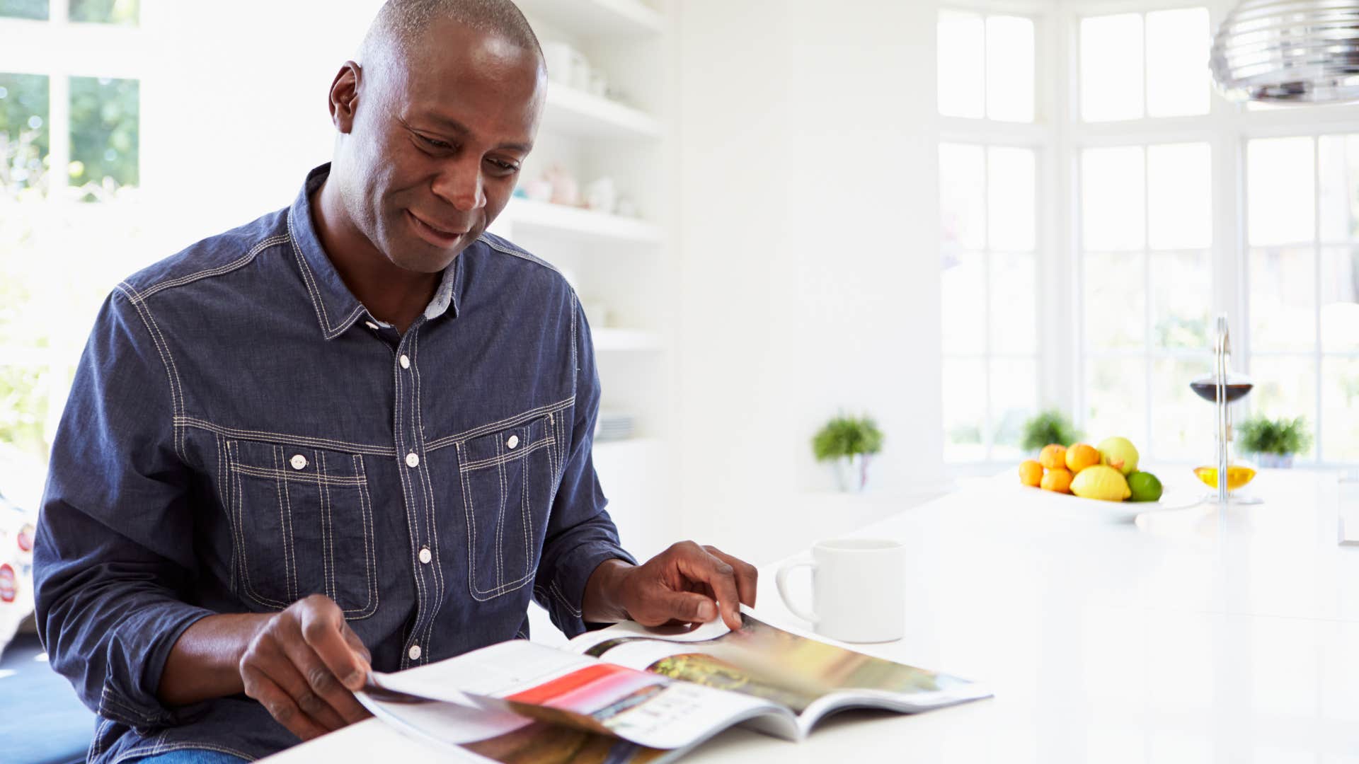 boomer man reading an old magazine
