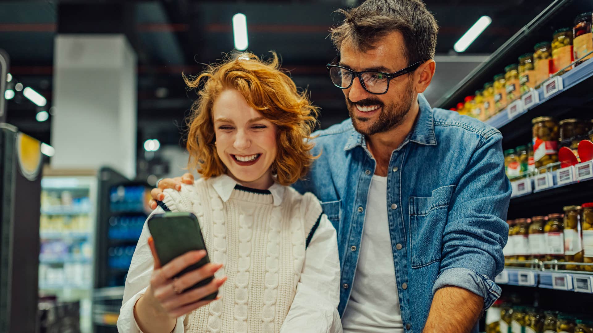 couple using coupons while shopping together