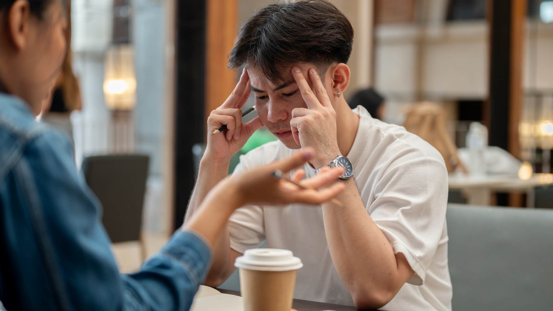 man frustrated with friend who's a backseat driver