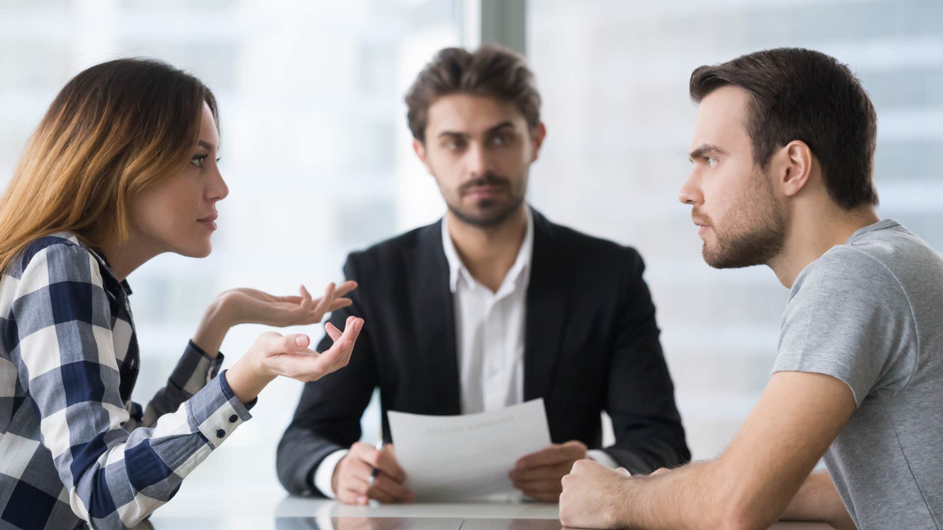exes arguing in front of divorce lawyer