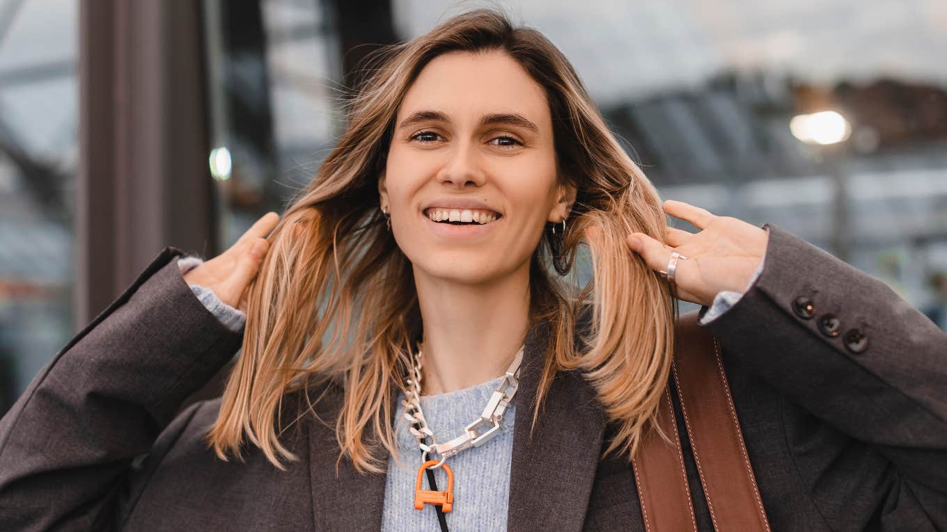 smiling intelligent woman hiding her inner thoughts