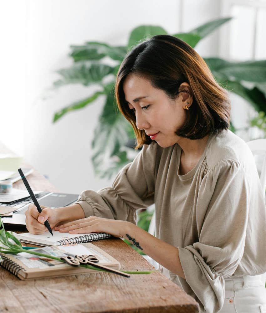 woman journaling hobbies anxious people find relaxing others tedious