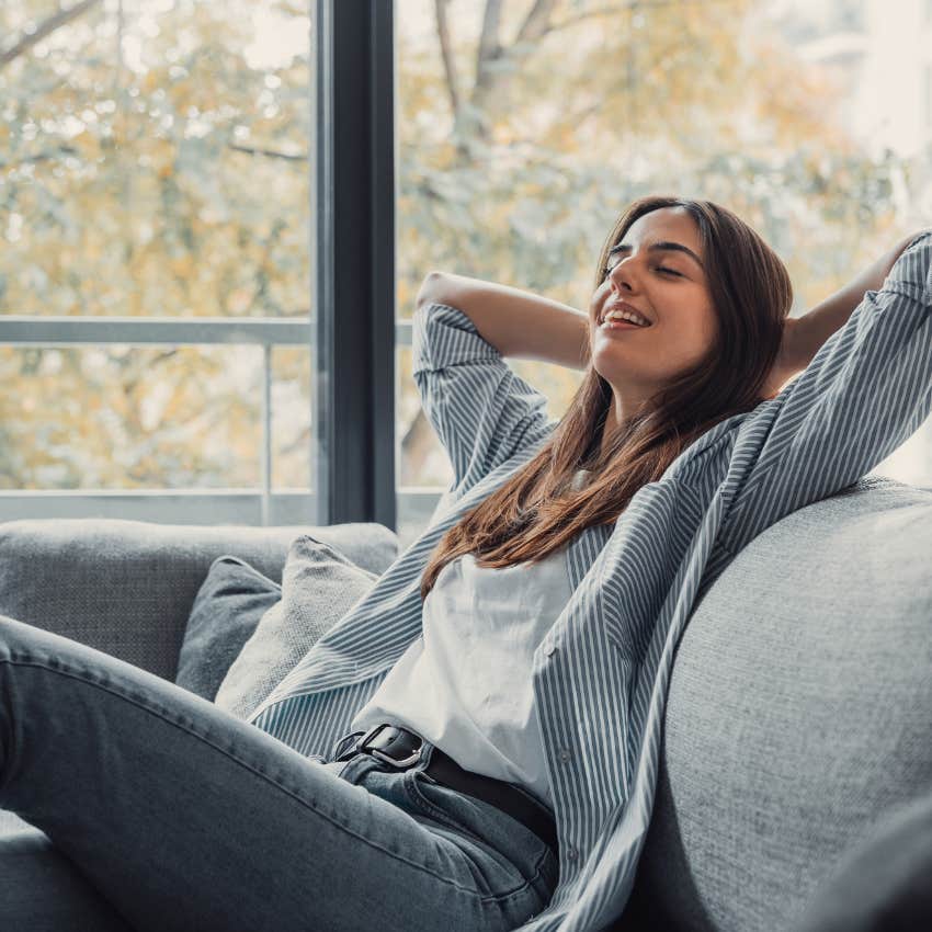 happy woman getting unstuck by sitting in quiet place