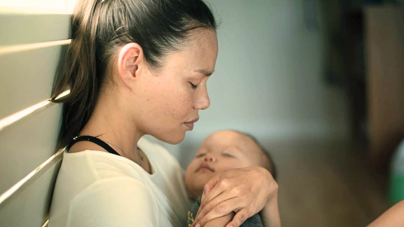 Heroic Moms Handle Sadnss When Everything Wrong Once Heroic mom handles her sadness when things go wrong while cradling baby