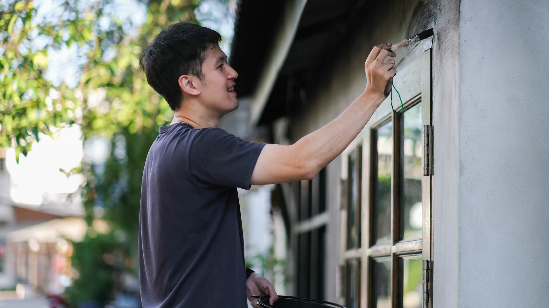 man consumed by house projects painting