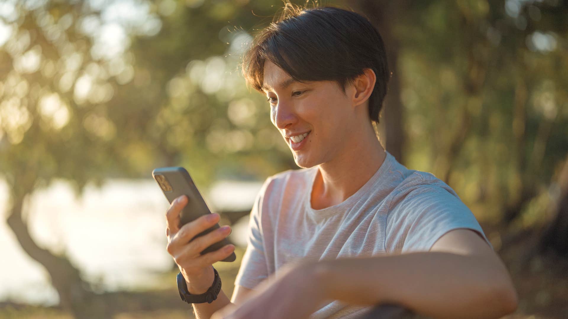 man spending too much time on his phone outside