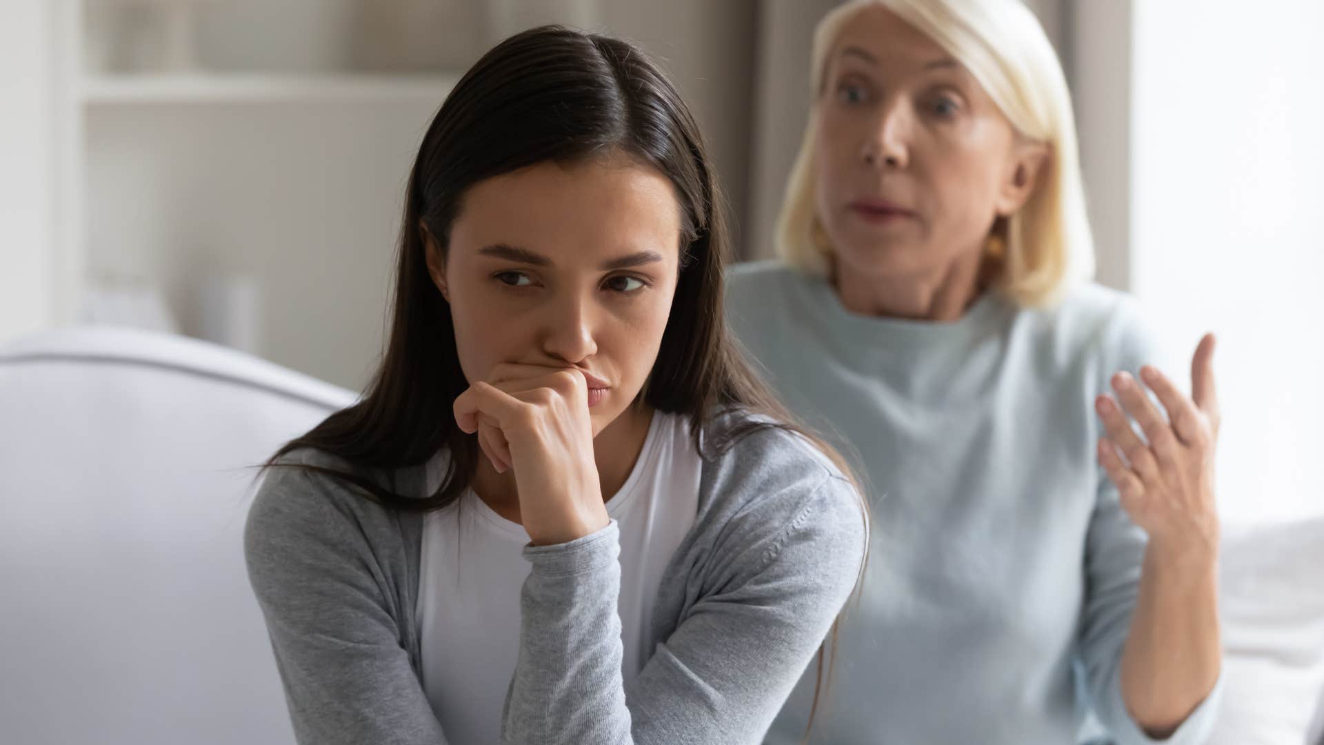 Woman saying "I'm not settling for a job without meaning" to her mother.