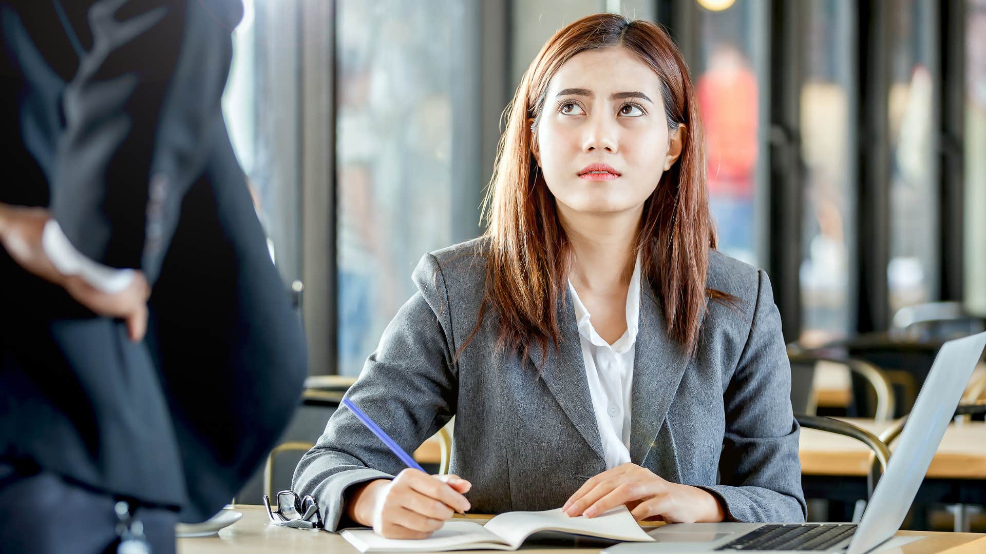 Woman saying "someone needs to teach me how" to her boss.