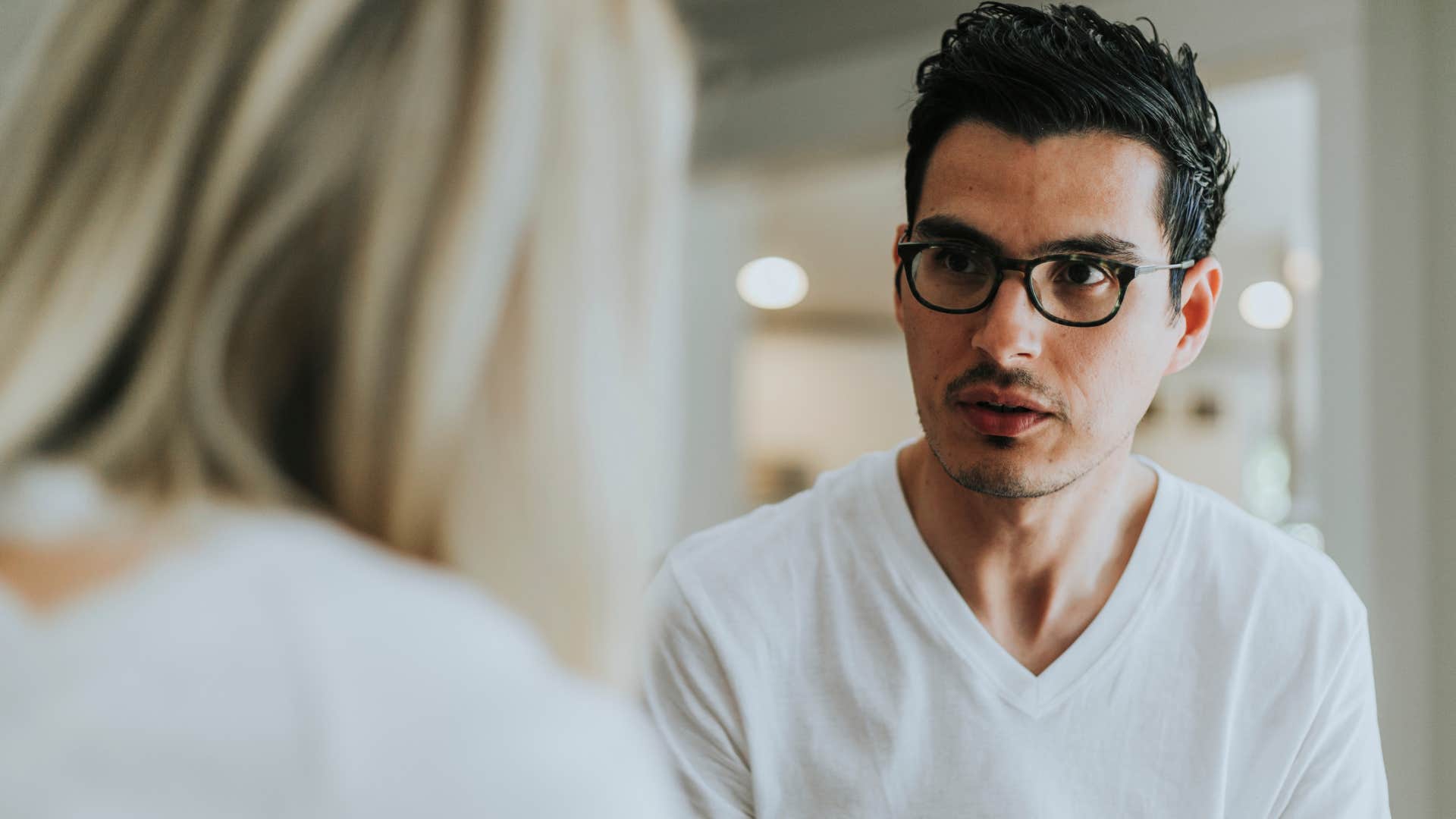 angry man telling woman he doesn't owe his parents anything