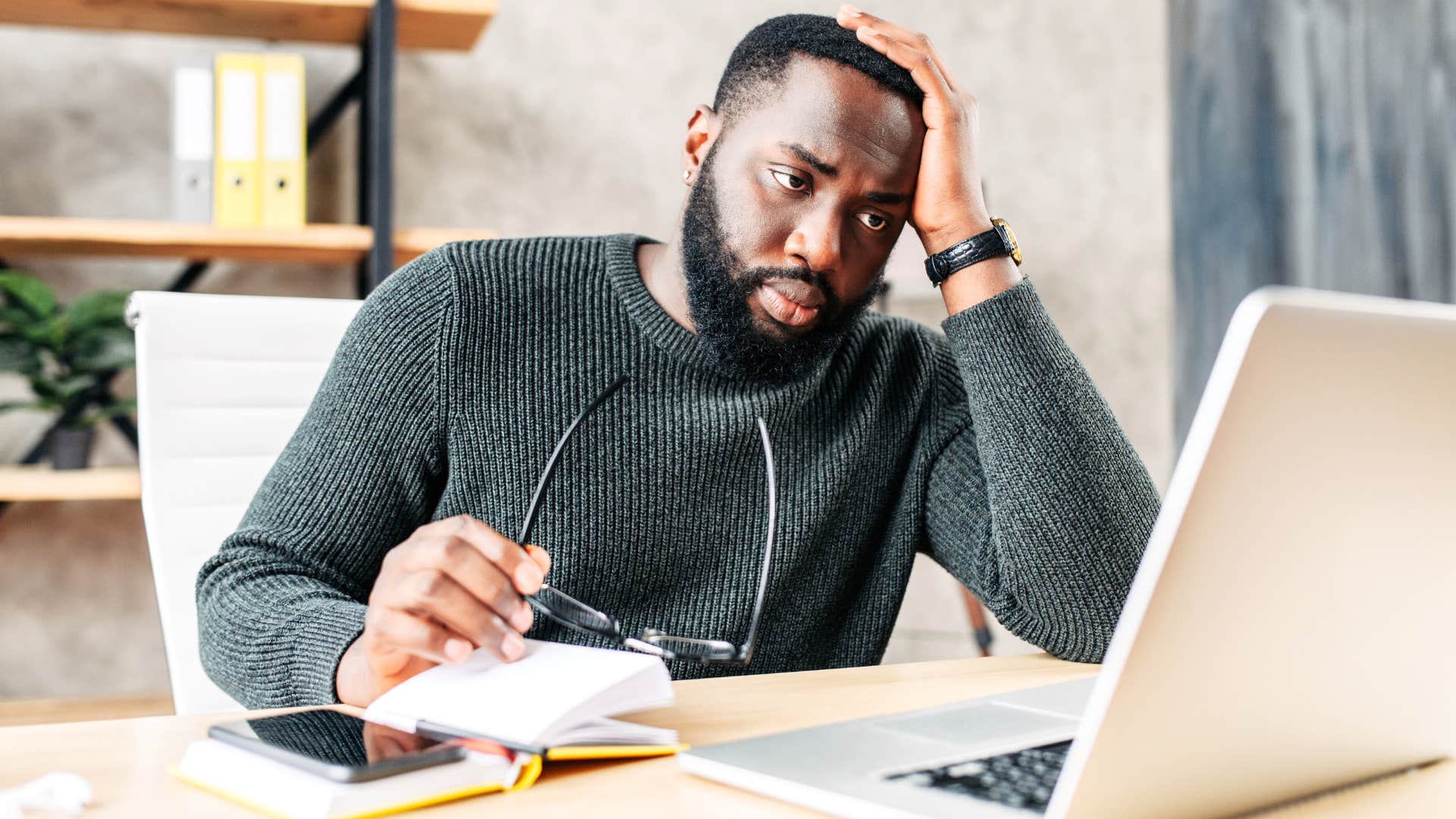 man thinking about his parents judging him