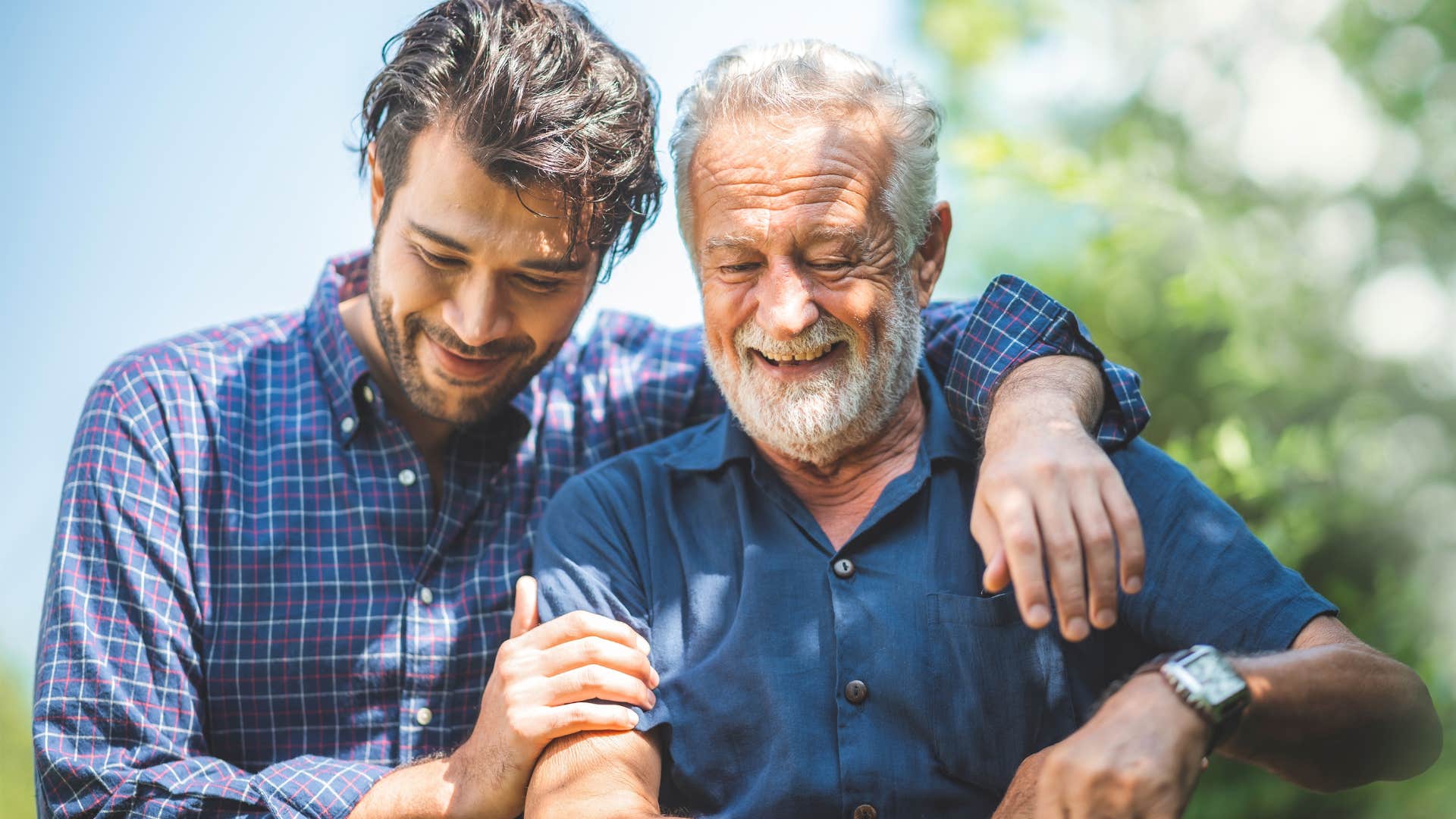 man saying I'm proud of you while hugging his son