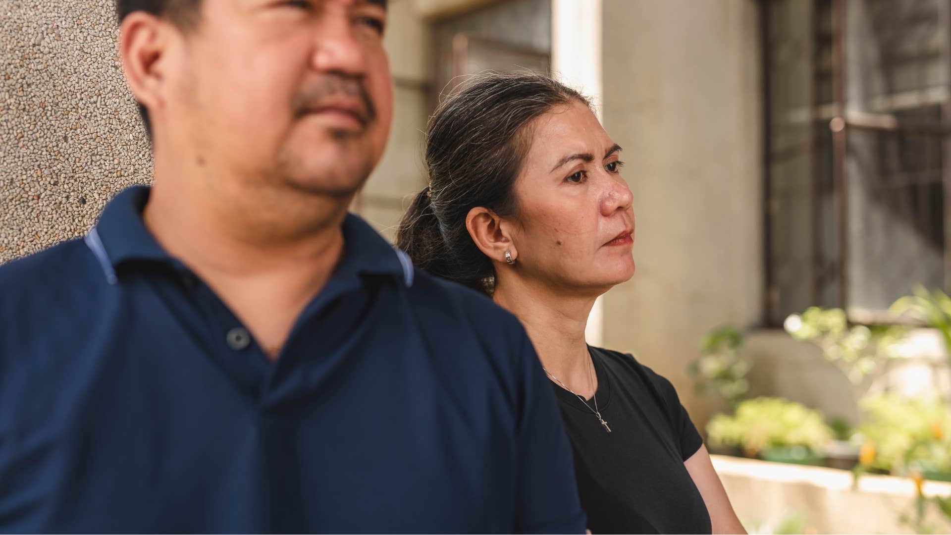 woman not asking for husband's opinion standing by him
