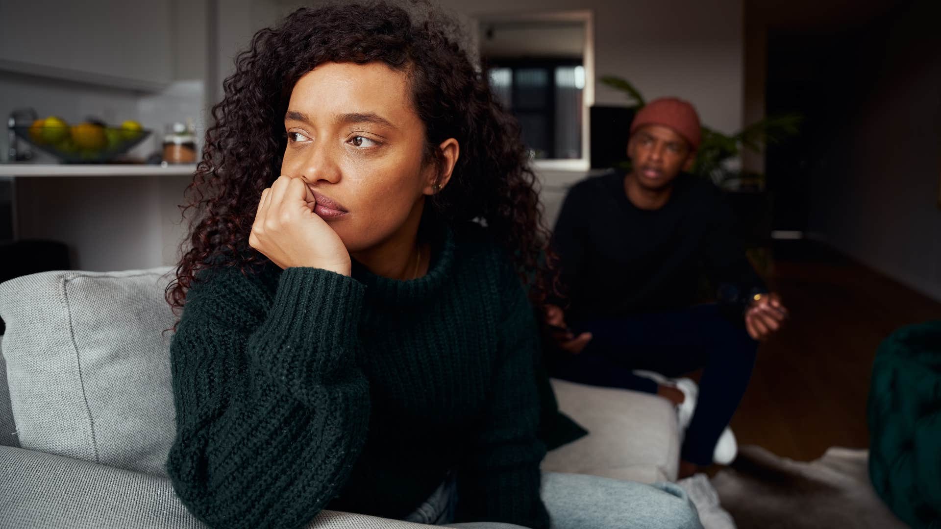 woman turned away from husband not checking in on him