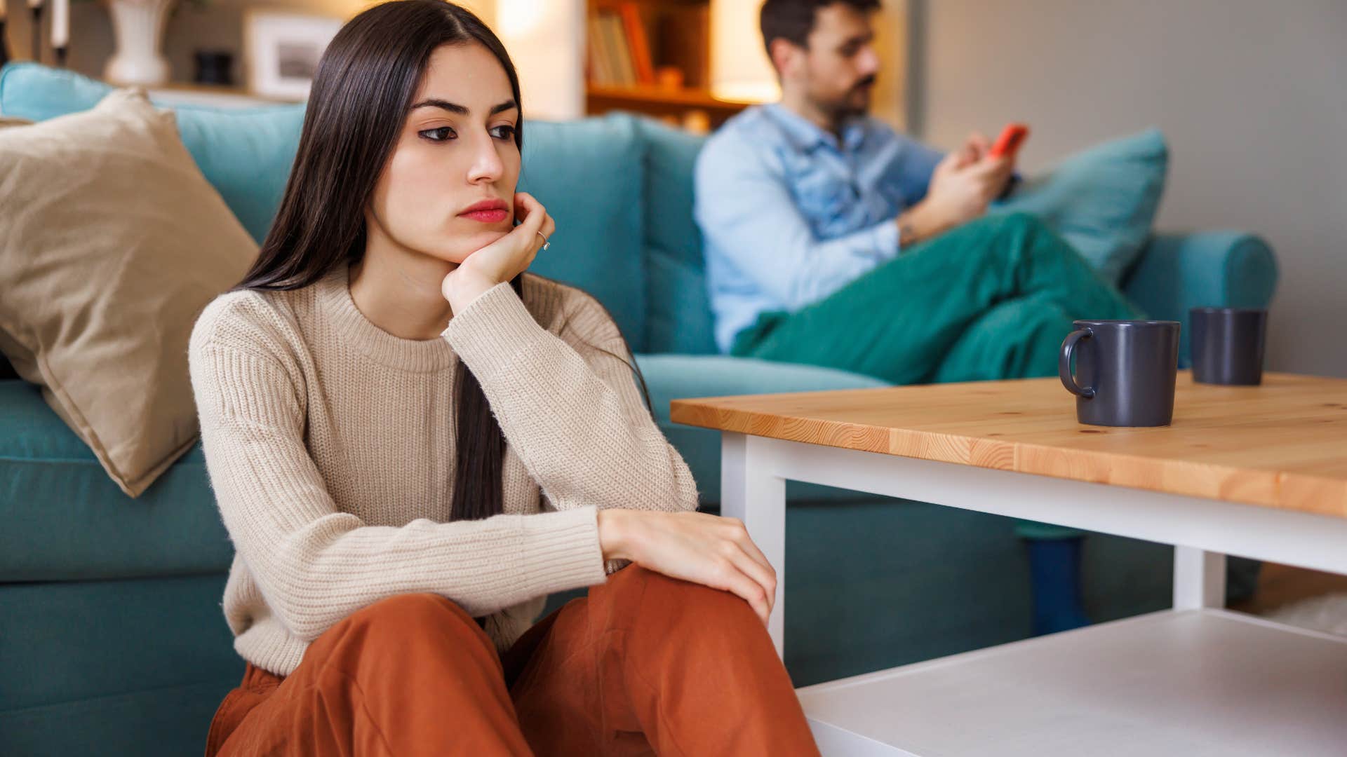 woman who's stopped initiating physical touch sitting away from husband