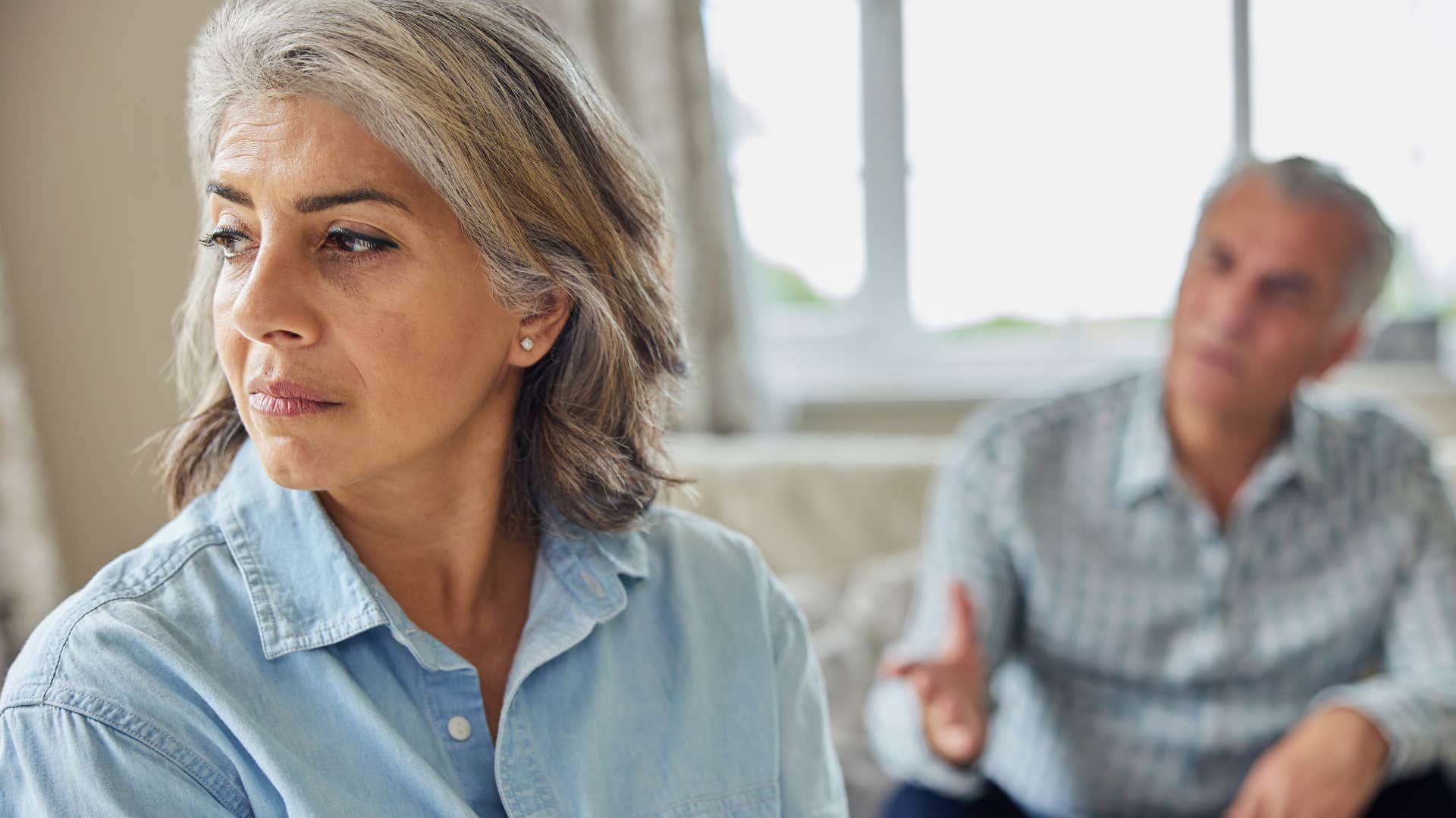 woman not making decision with her husband turned away from him