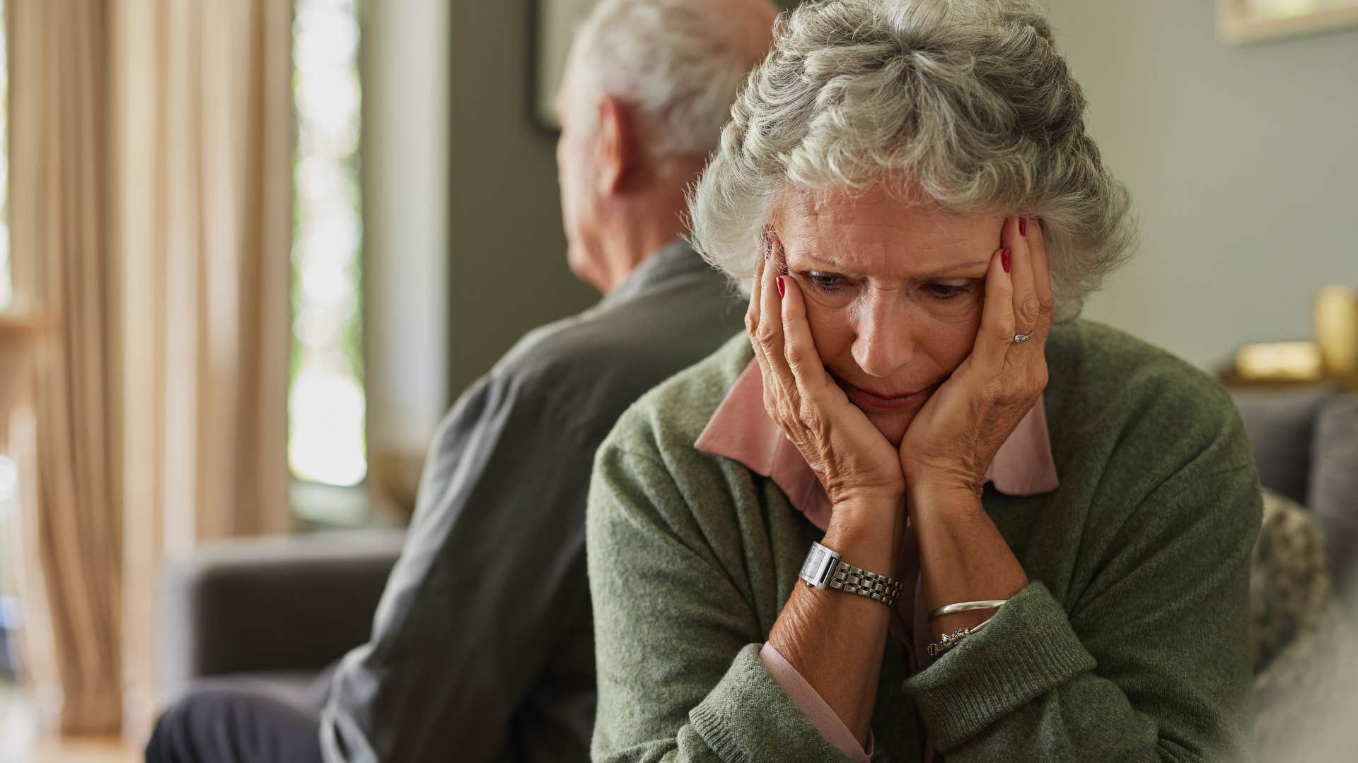 woman avoiding eye contact with her husband
