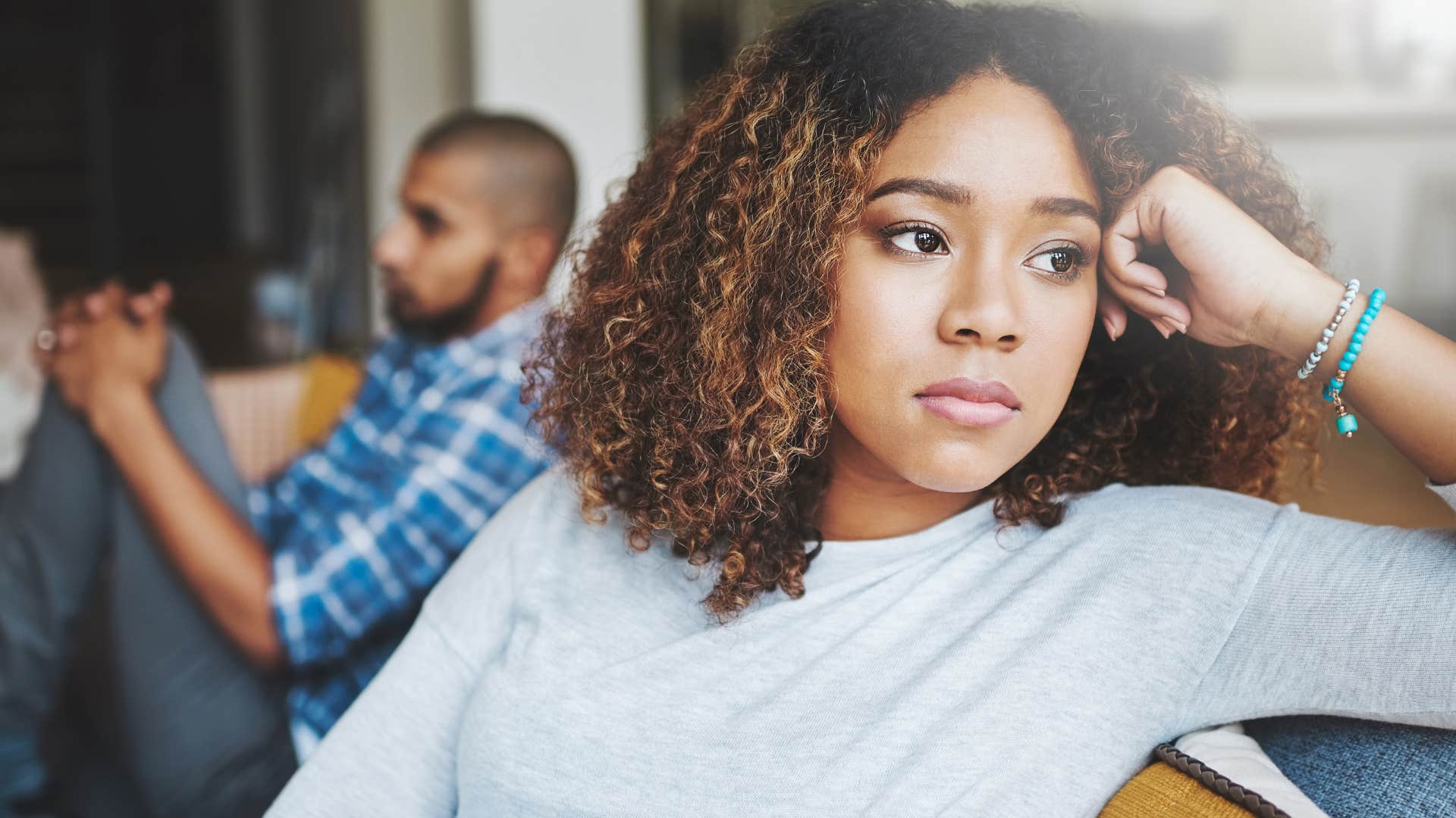 annoyed woman turned away from husband after saying I'm not interested