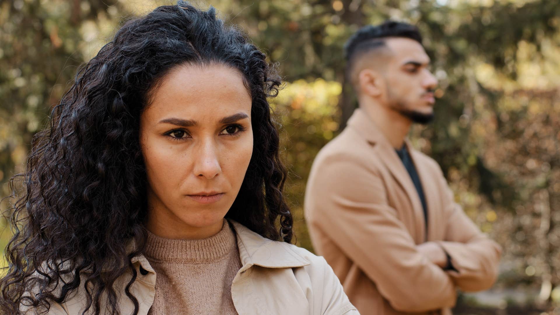woman avoiding couple photos with her husband