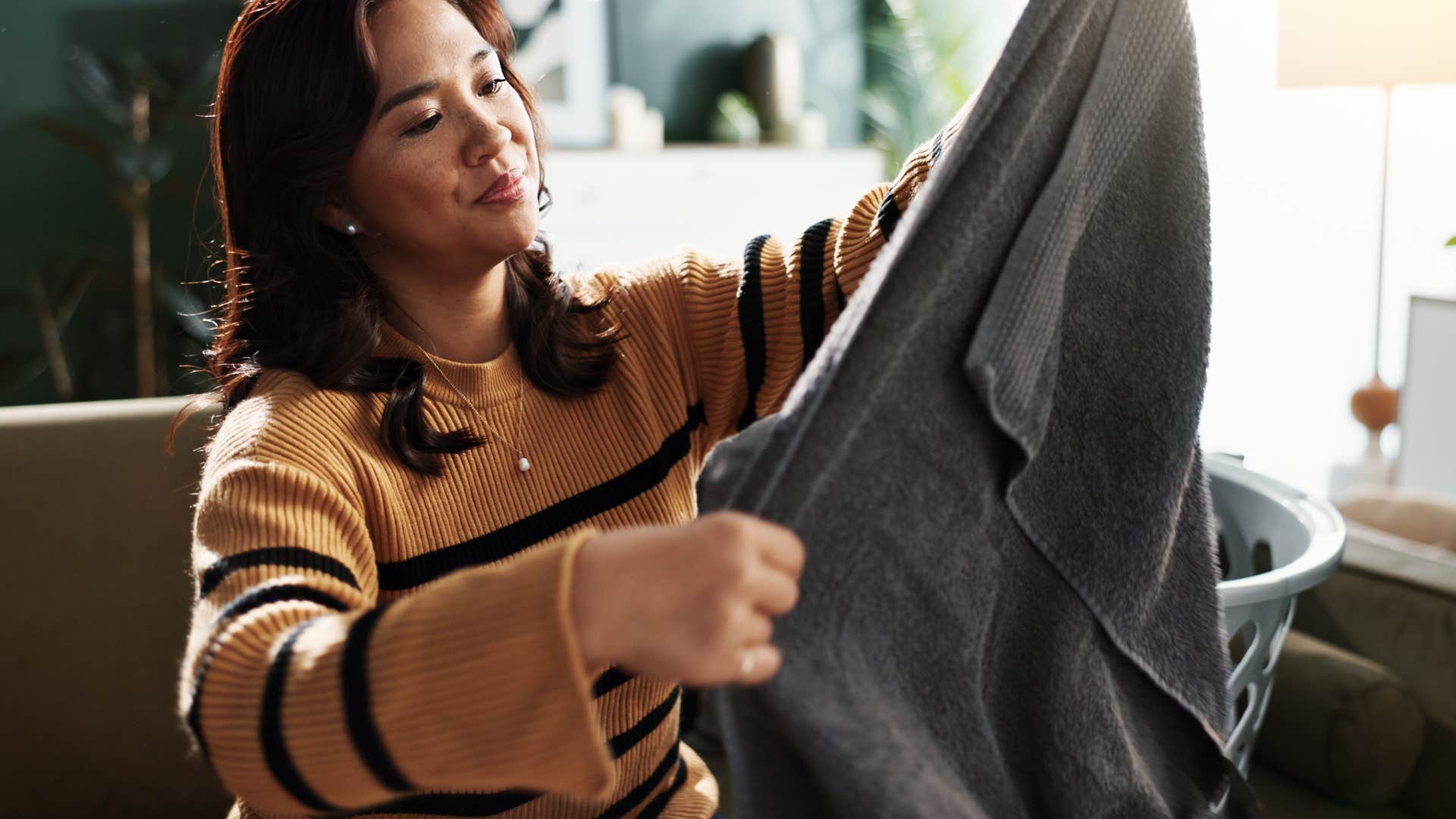 woman obsessively cleaning at home