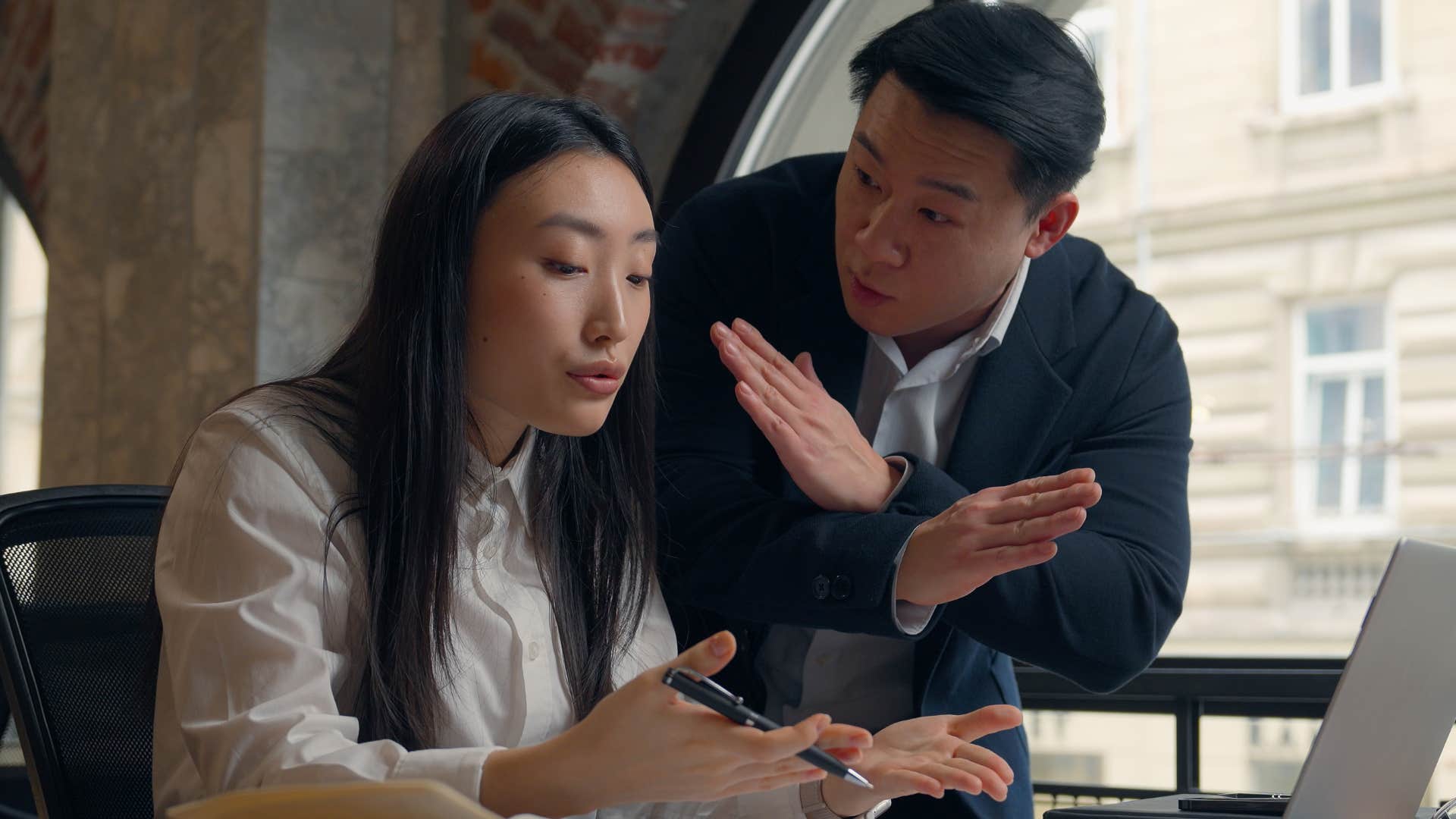 annoyed woman saying you're entitled to your opinion to her upset boss