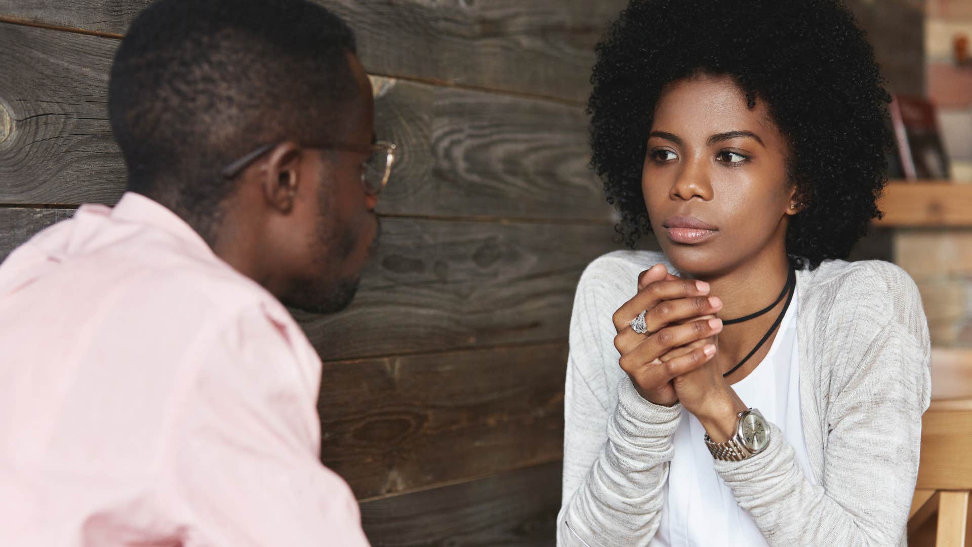 upset woman telling husband you're lucky I put up with you
