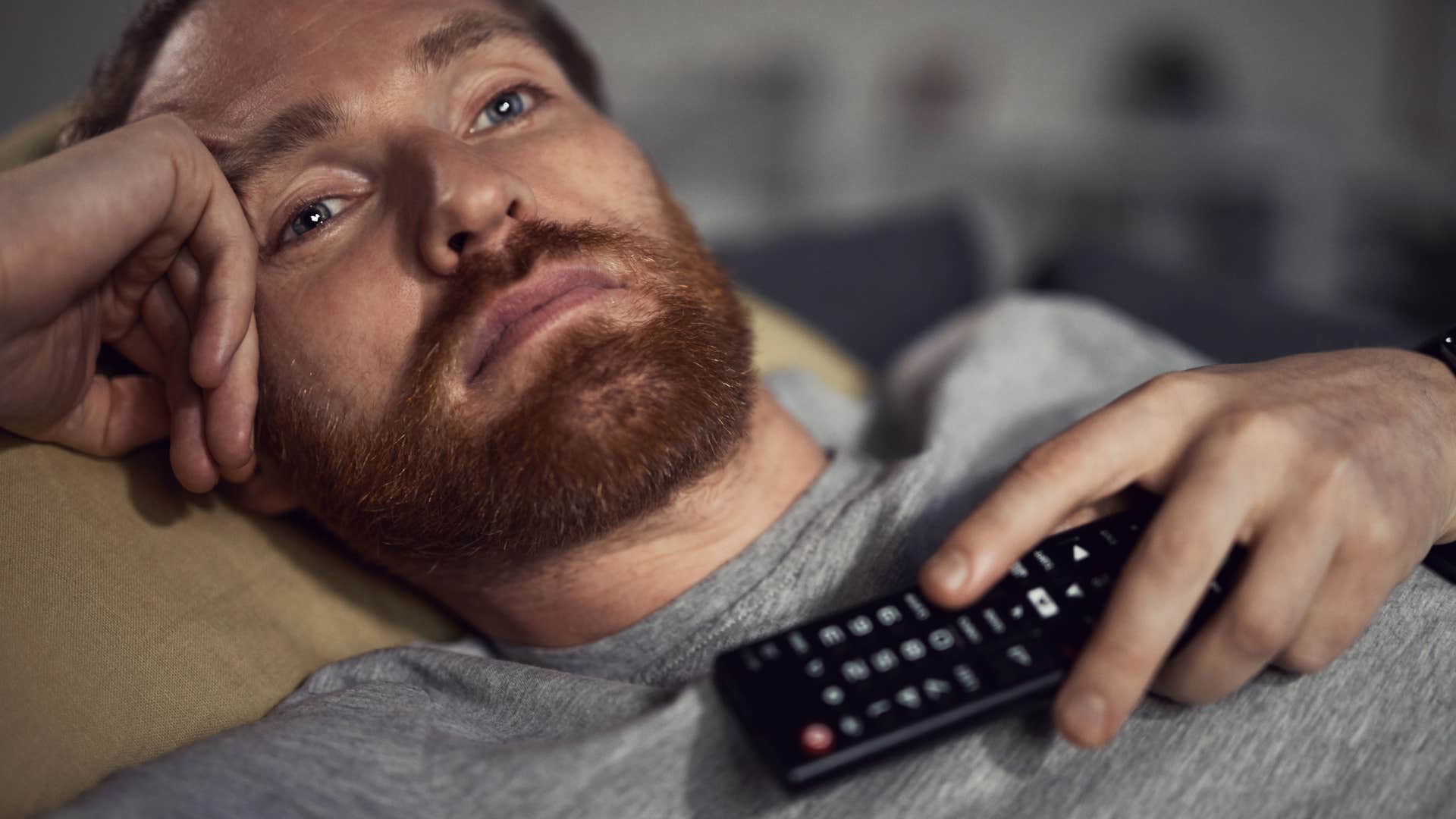 husband who doesn't spend enough time with his spouse alone watching tv