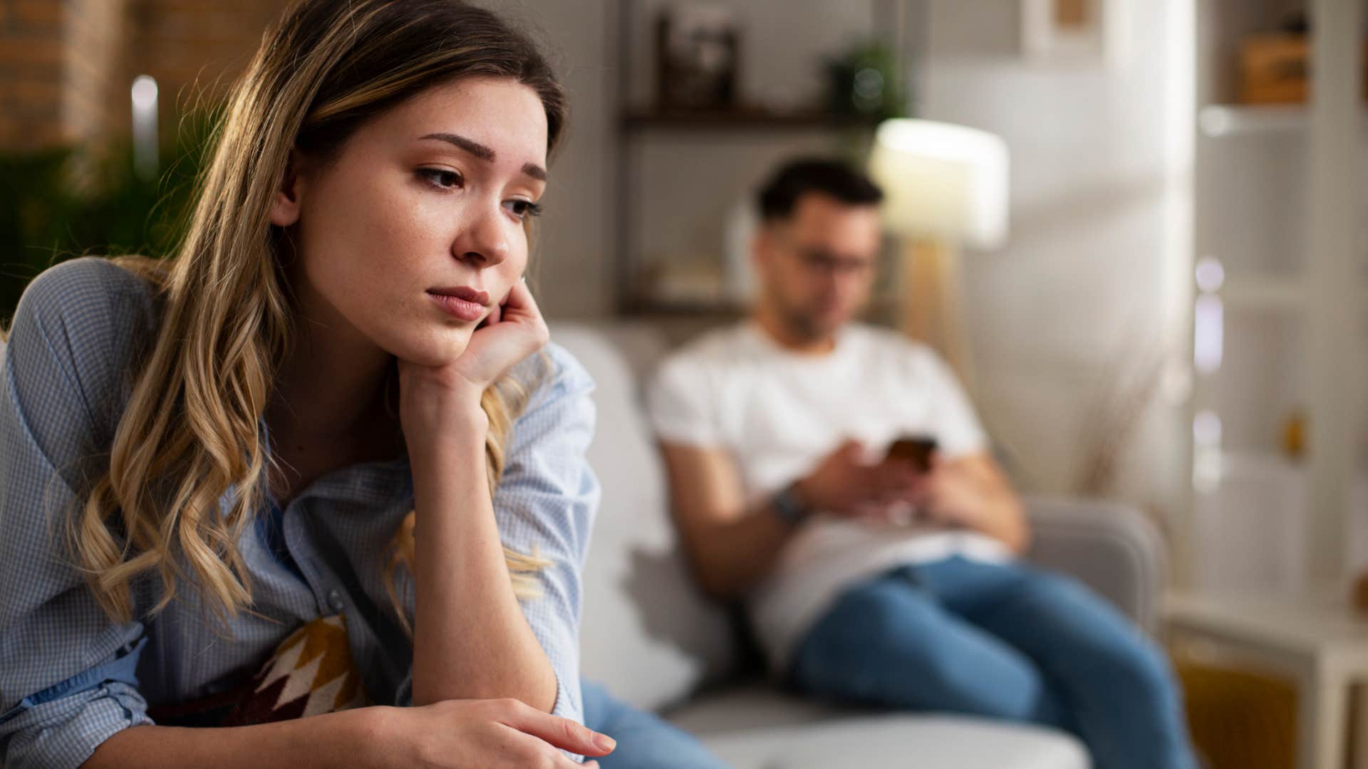 man not caring about asking wife for attention distracted by phone