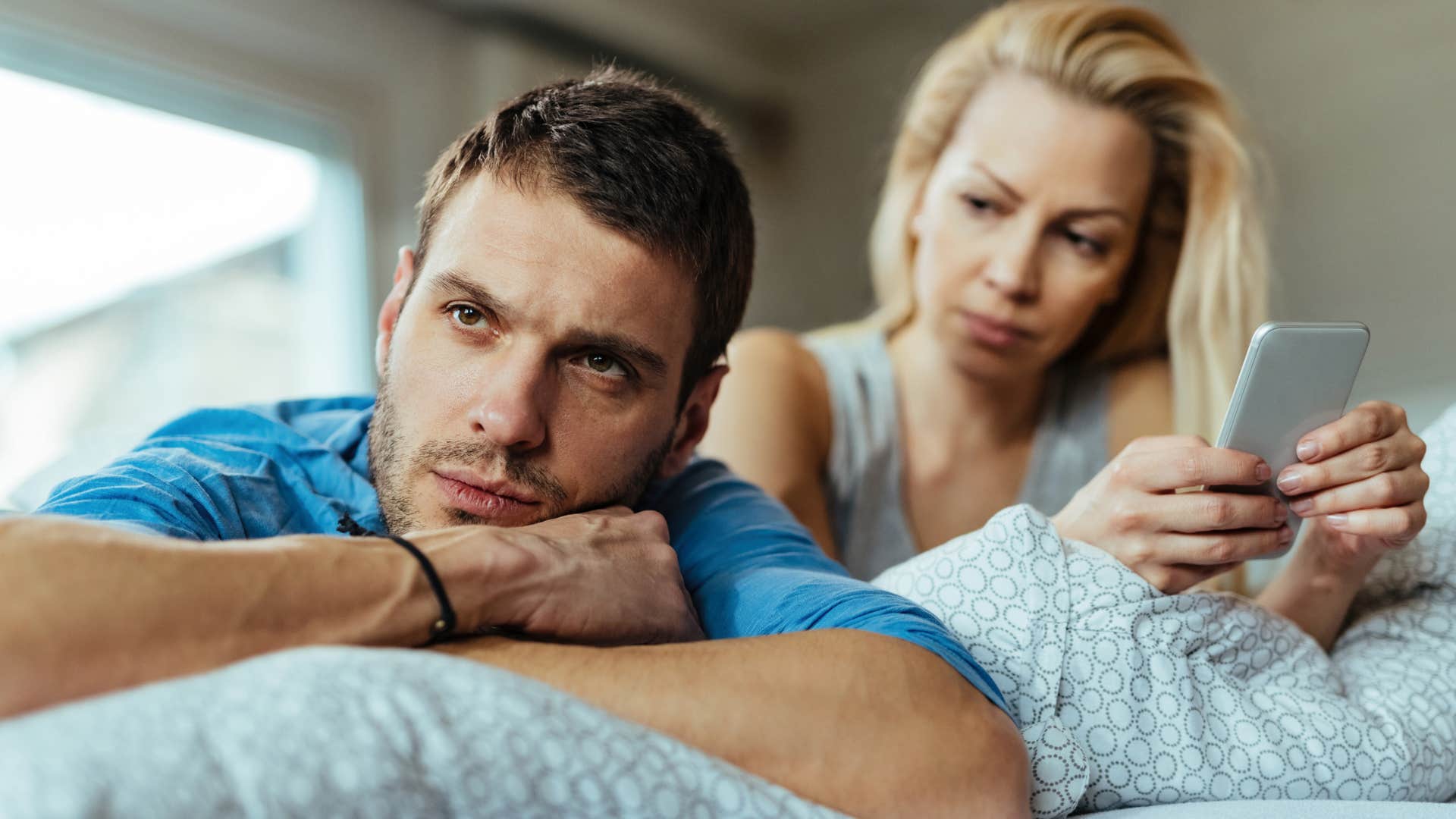 man refusing to initiate conversation ignoring wife speaking to him
