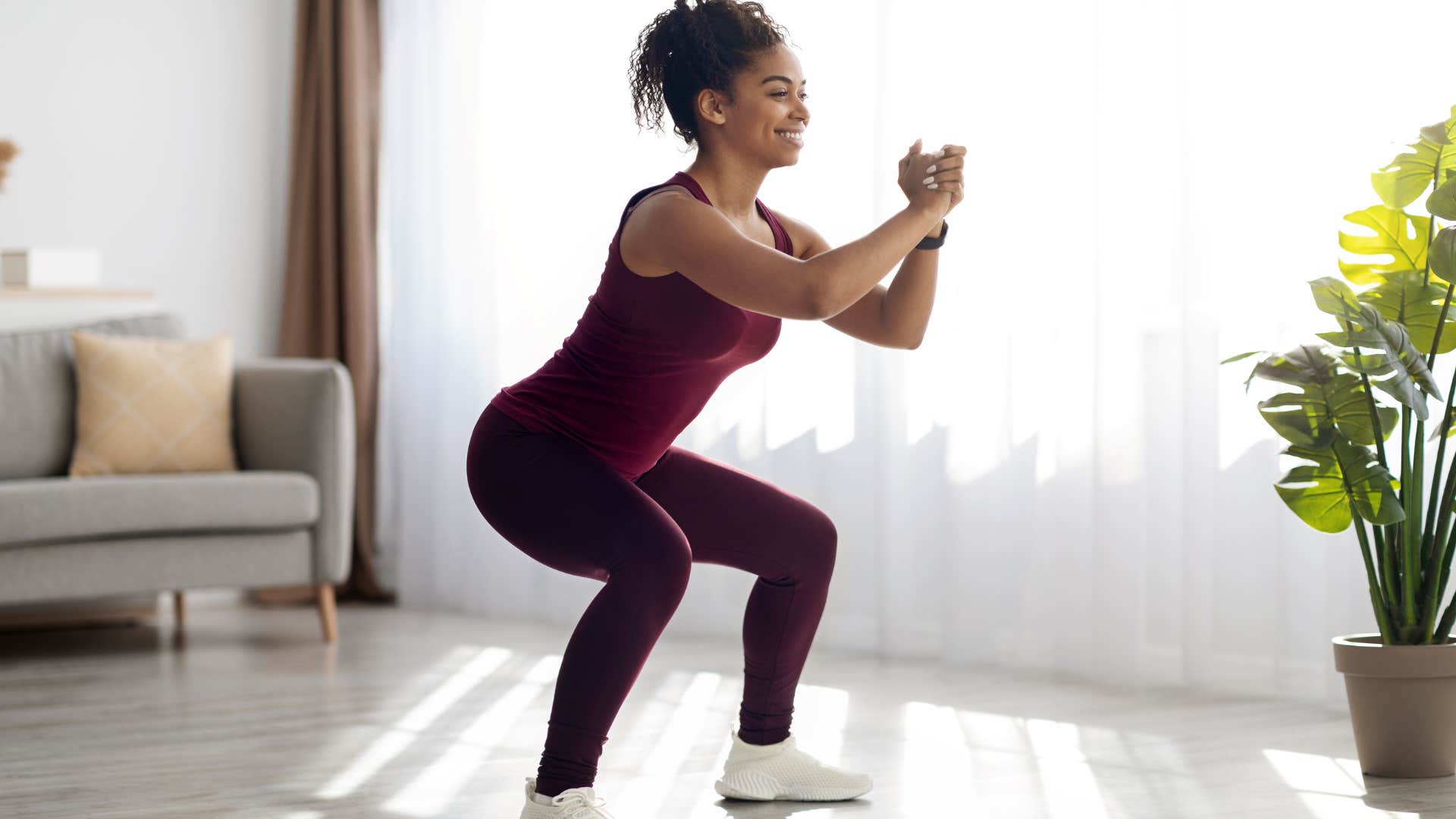 millennial woman working out in branded athleisure clothes