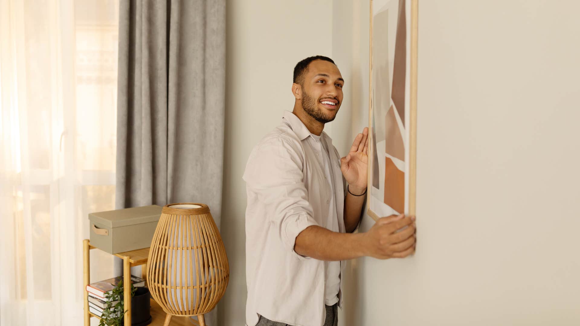millennial man hanging trendy decor