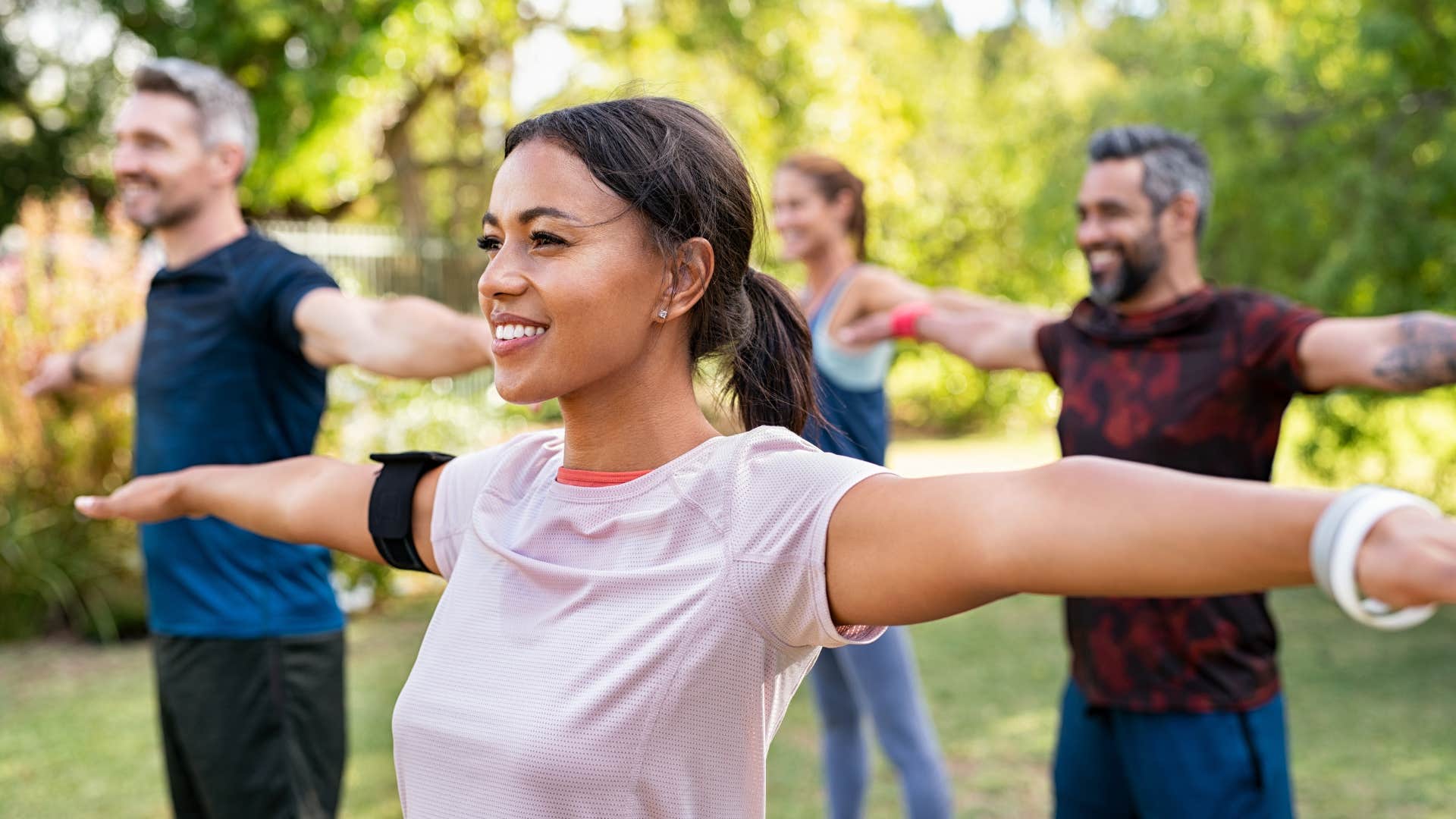 millennial woman in a group workout class