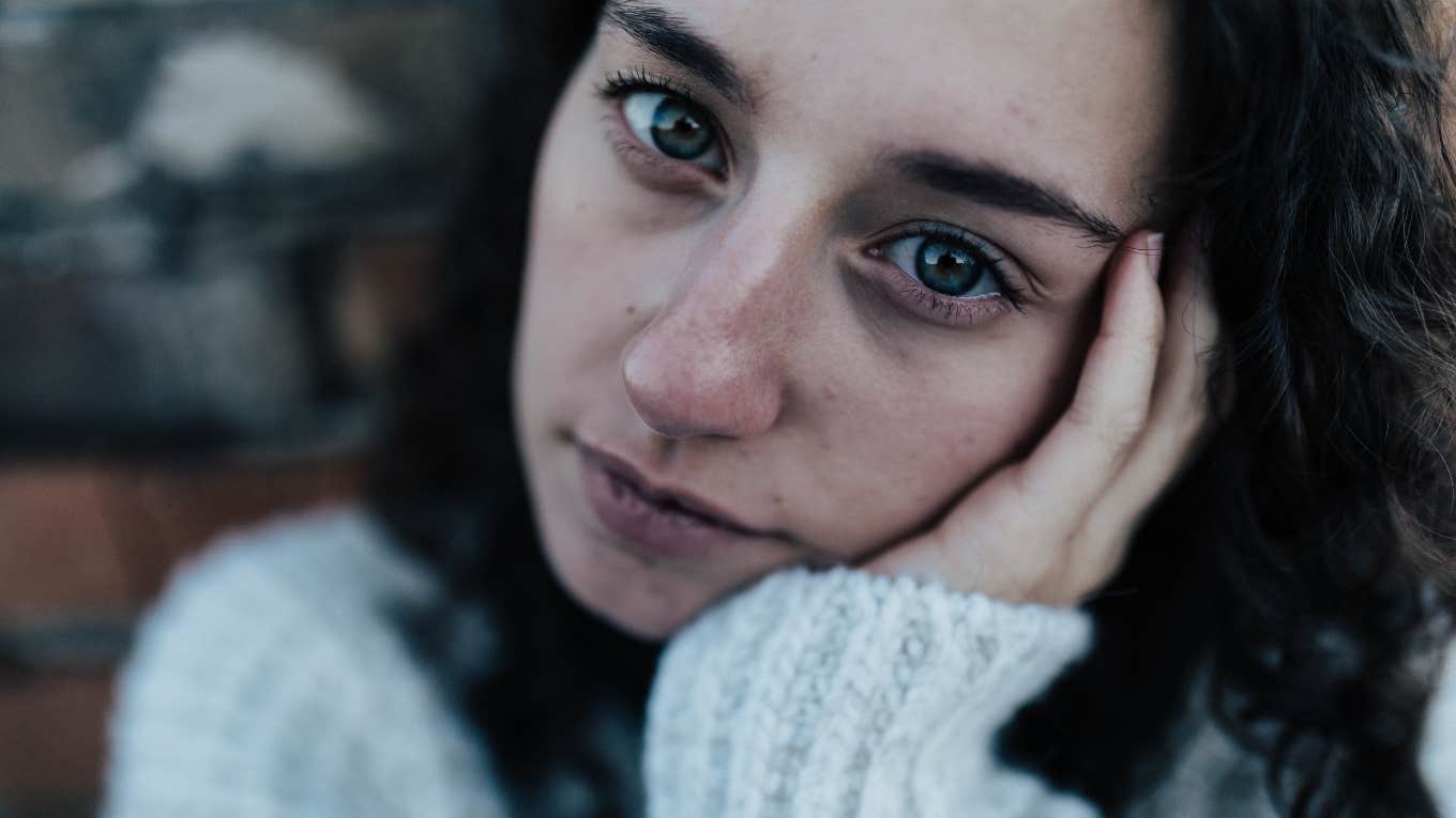 If You Notice These Things About Someone's Appearance, They're Struggling More Than They Admit sad woman struggling with her mental well-being