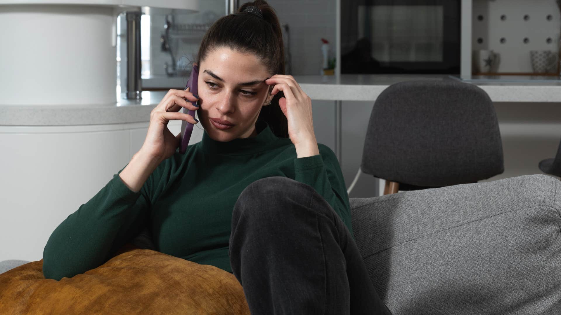 Woman saying "I'm not ready for guests" on the phone.