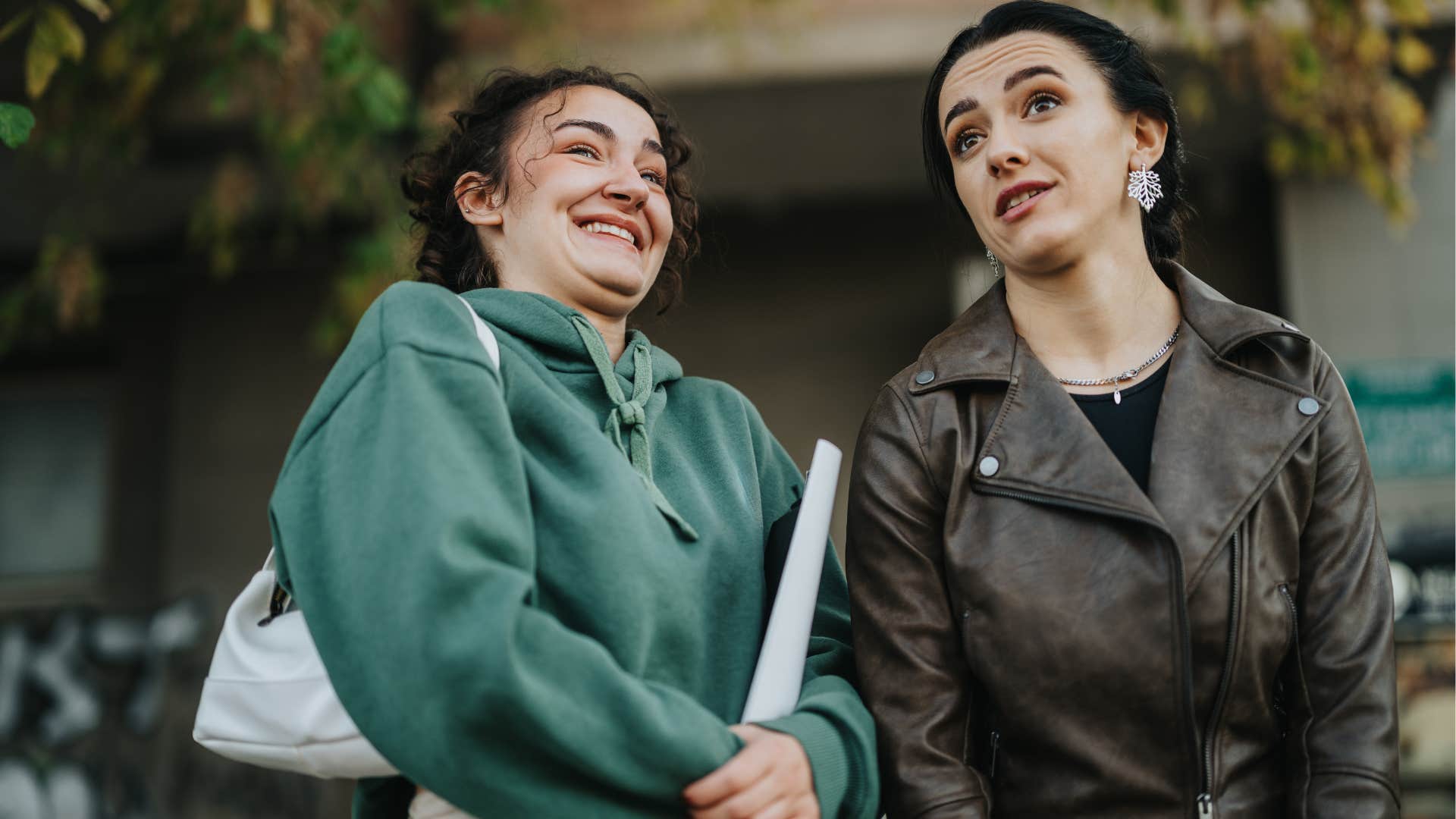woman saying now's not a great time for a photo to her friend