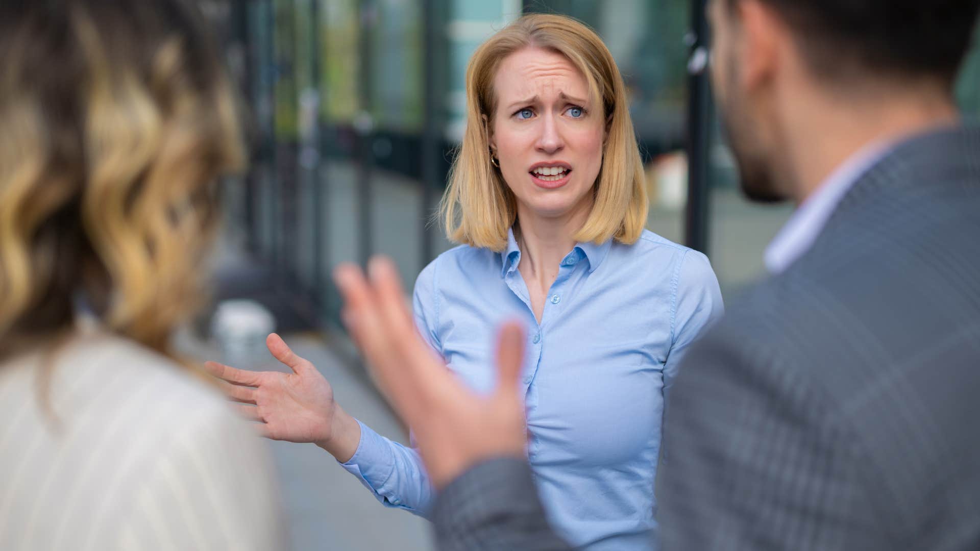 embarrassed woman telling colleagues I wasn't planning on seeing anyone today
