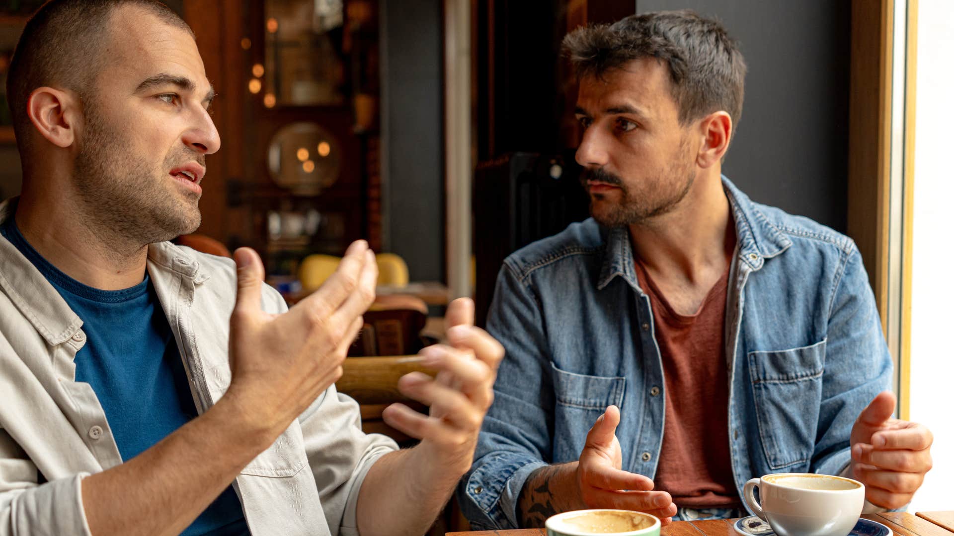 Man saying "it's kind of a disaster right now" to a friend.