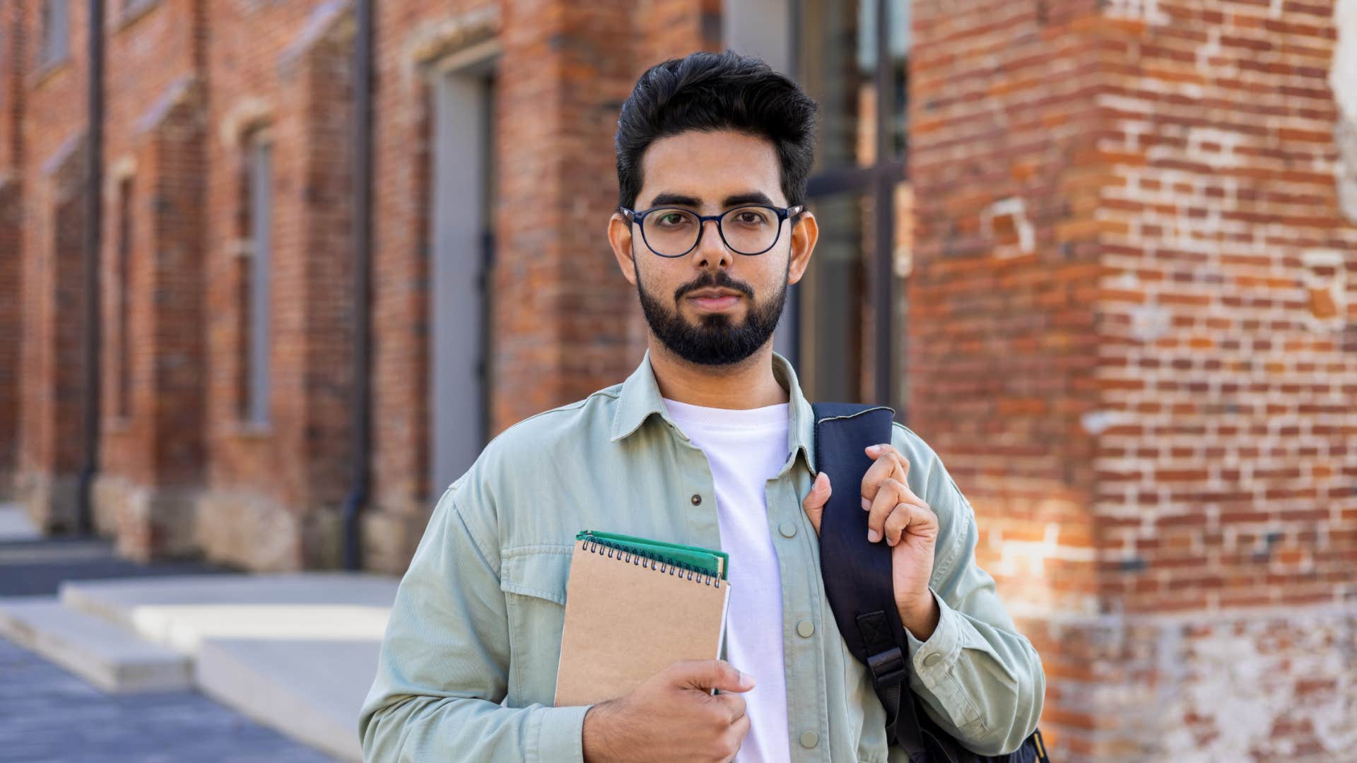 young man well dressed standing outside