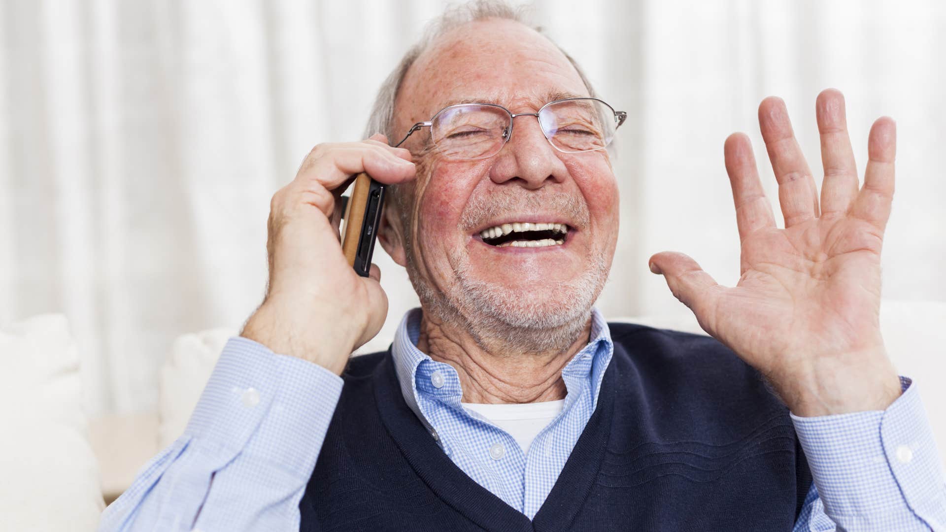 happy man on the phone with his adult children